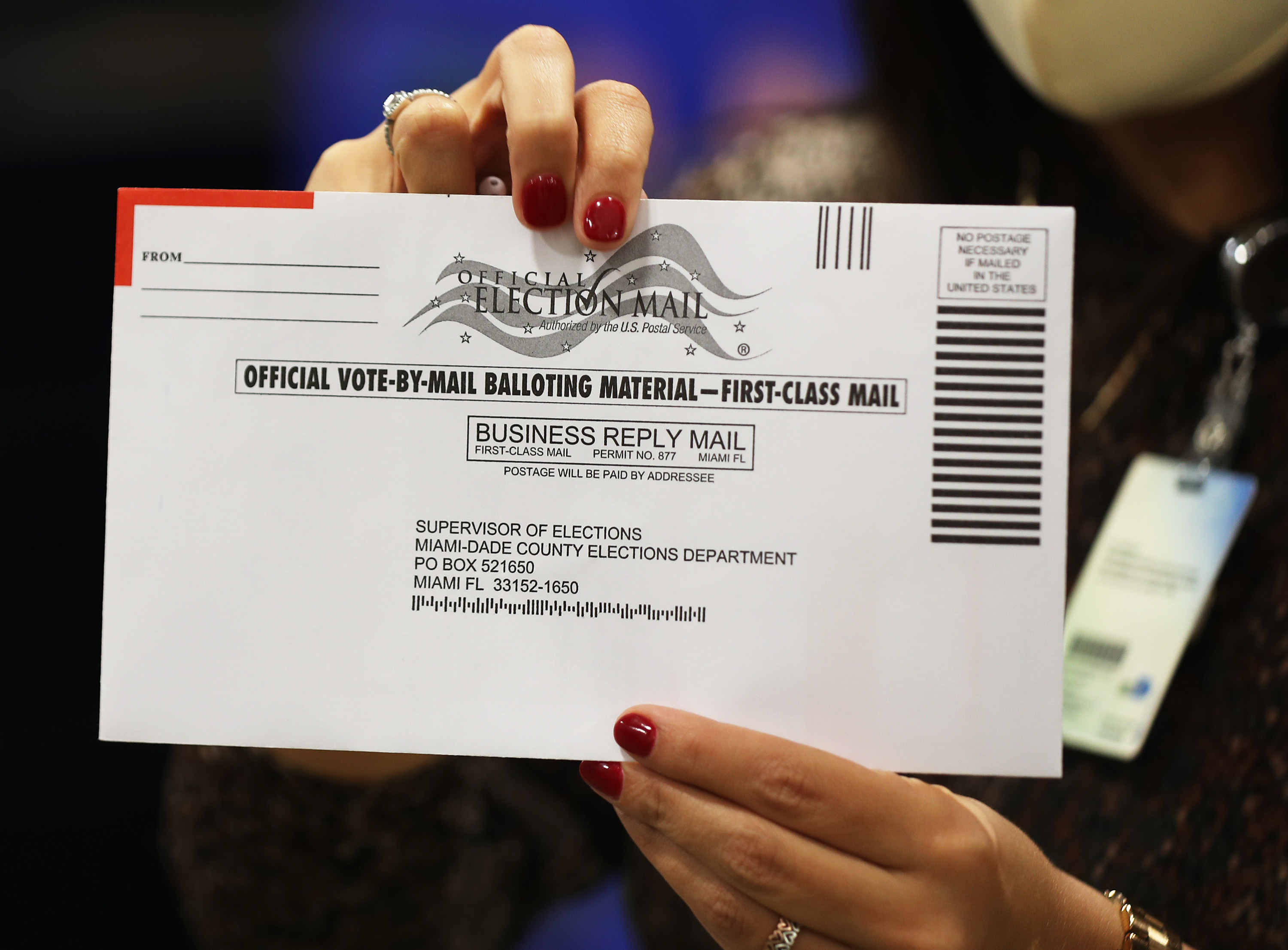 DORAL, FLORIDA - OCTOBER 01: An envelope with a vote-by-mail ballot inside is shown to the media at the Miami-Dade County Election Department on October 01, 2020 in Doral, Florida. The Miami-Dade County Elections Department mailed out via the U.S. Post Office more than 530,000 vote-by-mail ballots to voters with a request on file for the November 3, 2020 General Election. (Photo by Joe Raedle/Getty Images)