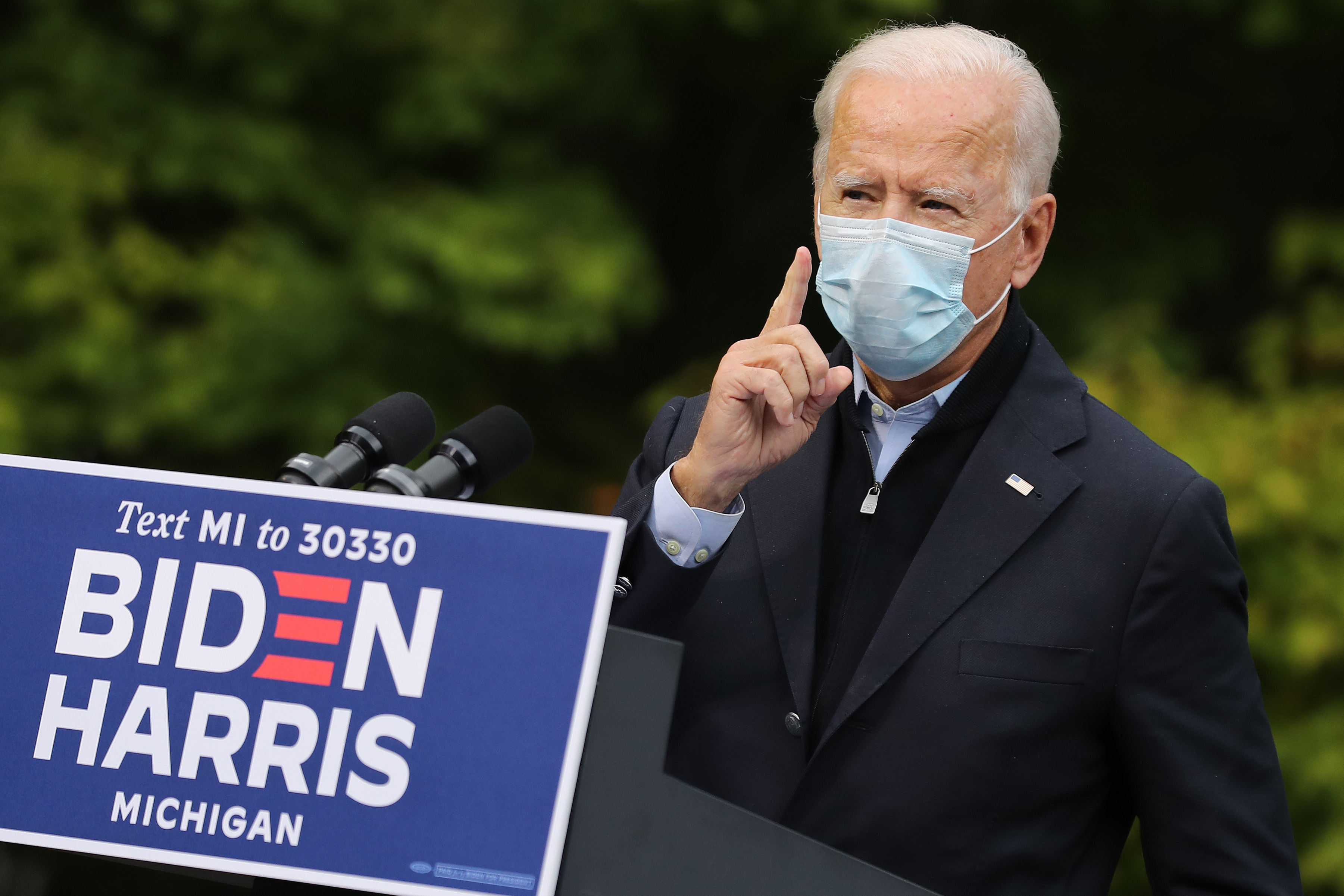 GRAND RAPIDS, MICHIGAN - OCTOBER 02: Democratic presidential nominee Joe Biden delivers remarks in the parking lot of the United Food and Commercial Workers International Union Local 951 while campaigning October 02, 2020 in Grand Rapids, Michigan. Biden said he tested negative twice Friday for the coronavirus after it was reported that U.S. President Donald Trump and first lady Melania Trump tested positive for COVID-19. (Photo by Chip Somodevilla/Getty Images)