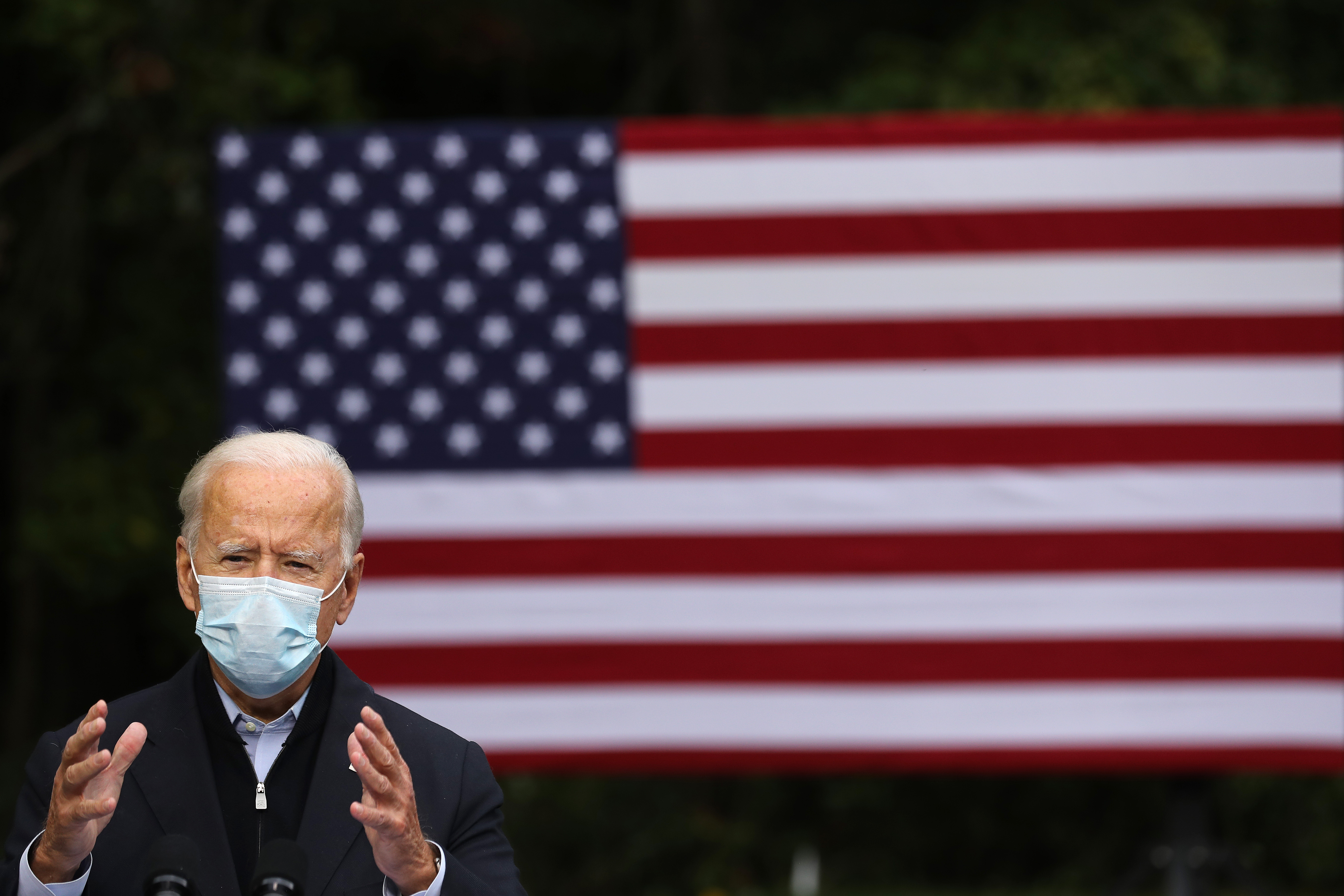 GRAND RAPIDS, MICHIGAN - OCTOBER 02: Democratic presidential nominee Joe Biden delivers remarks in the parking lot of the United Food and Commercial Workers International Union Local 951 while campaigning October 02, 2020 in Grand Rapids, Michigan. Biden said he tested negative twice Friday for the coronavirus after it was reported that U.S. President Donald Trump and first lady Melania Trump tested positive for COVID-19. (Photo by Chip Somodevilla/Getty Images)