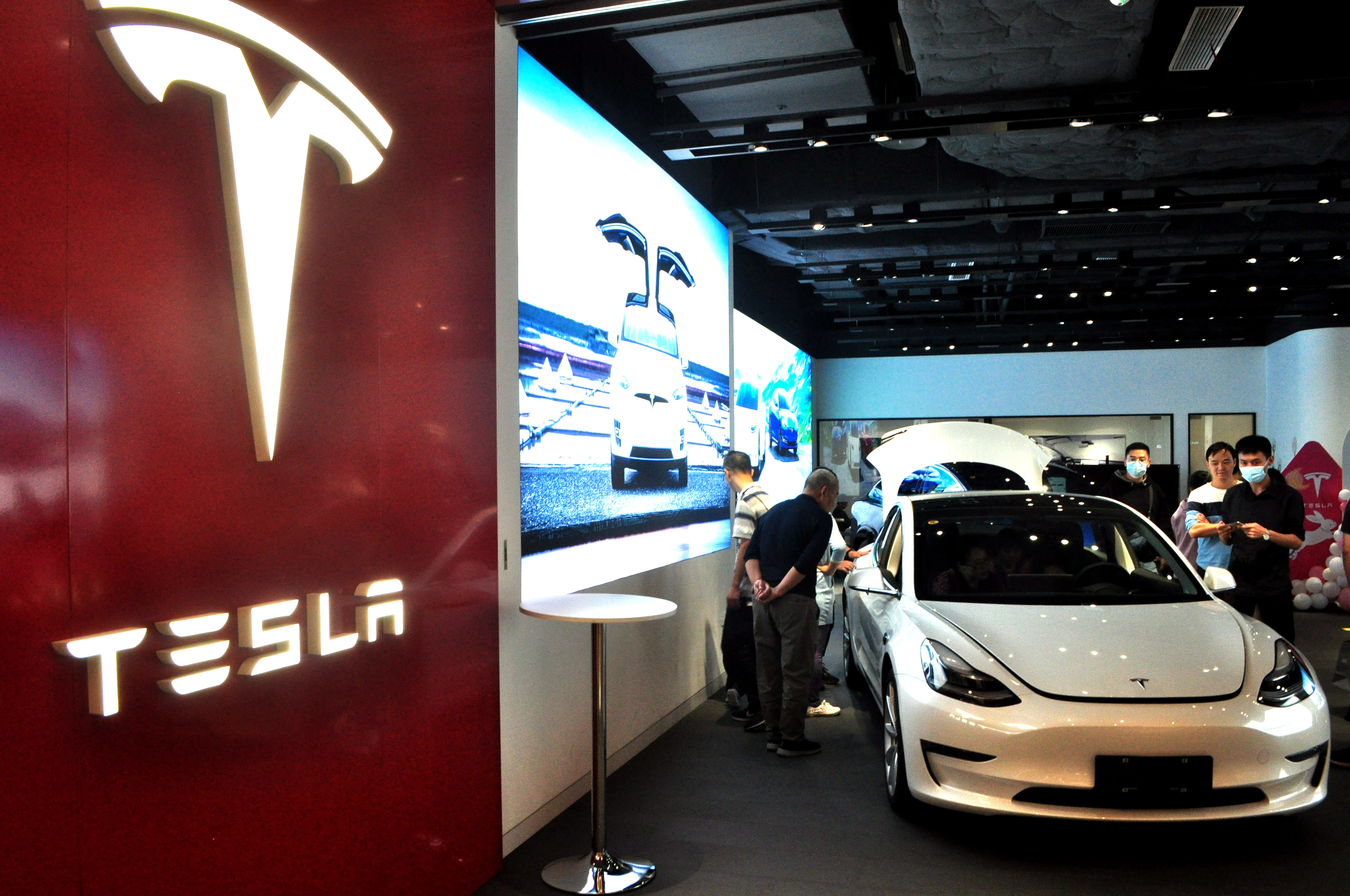 A Tesla store on Oct. 7, 2020, in Shanghai. The EV maker reported a big earnings beat on Wednesday, exciting investors even as questions swirl around the future profitability of its core autos business. (Yan Daming—VCG via Getty Images)