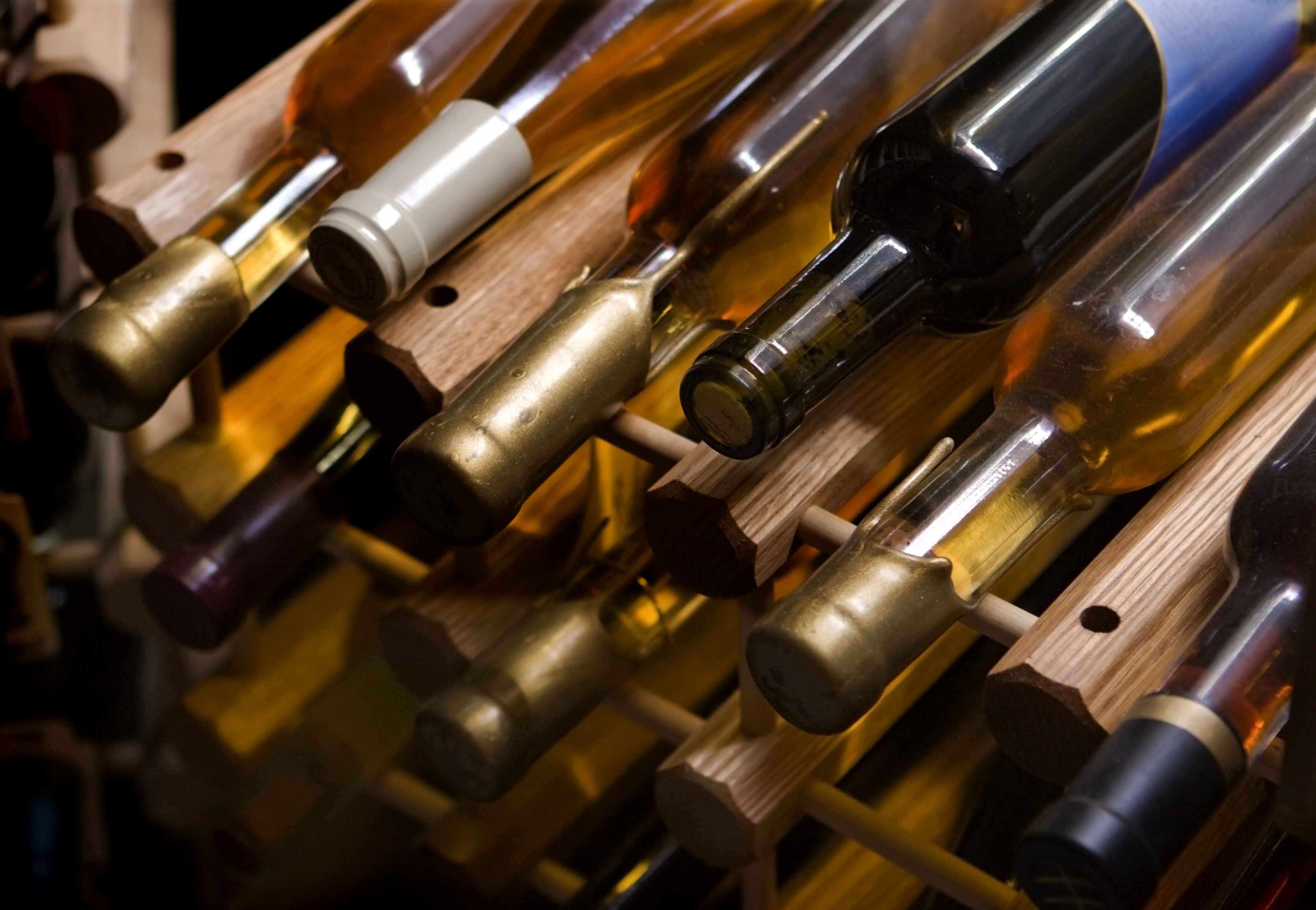 While aging in a cellar is best, for most that is unattainable. Storing wines in a fridge works just as well.