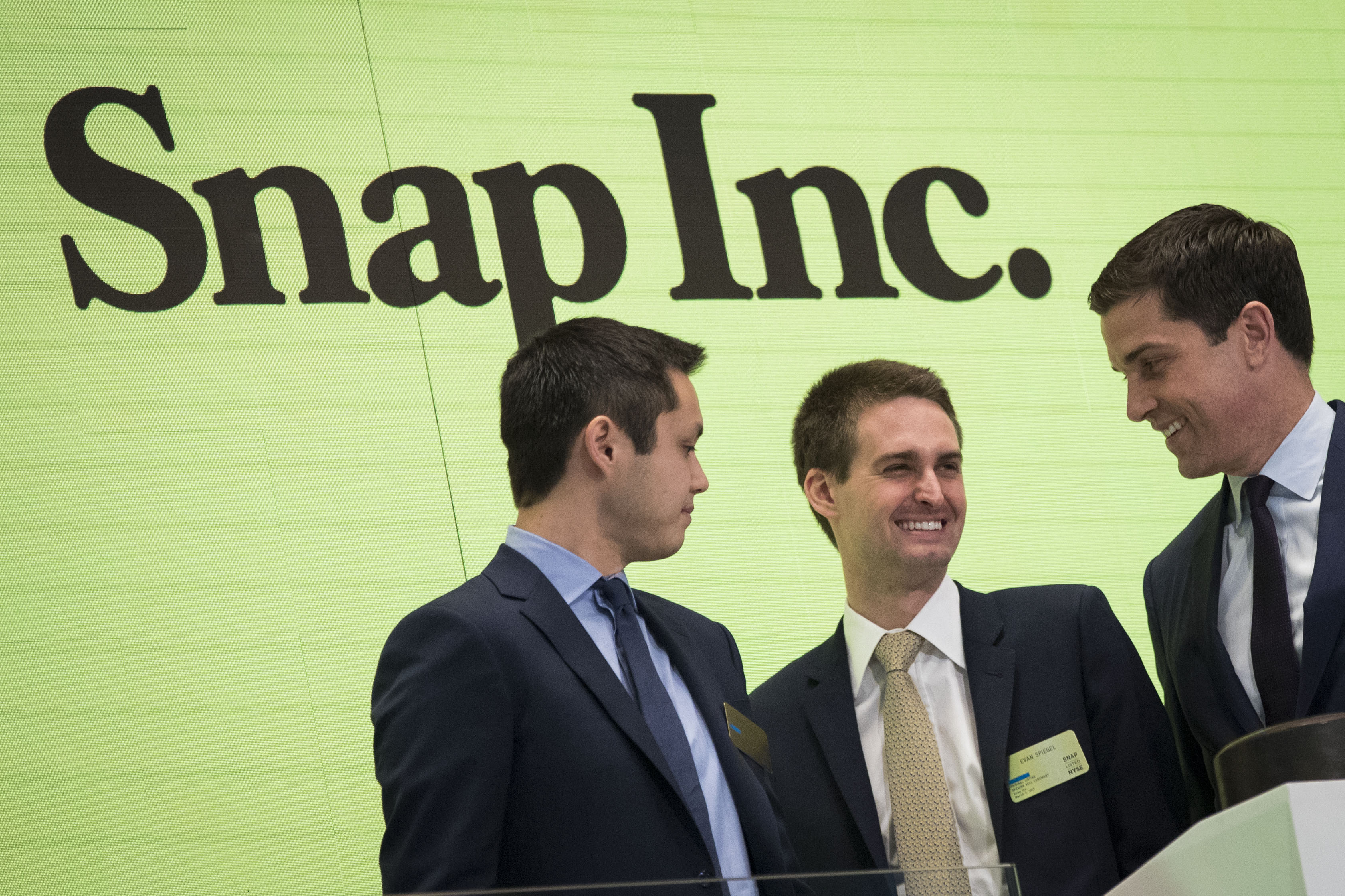 Snapchat co-founders Bobby Murphy, chief technology officer of Snap Inc., and Evan Spiegel, chief executive officer of Snap Inc., at the ringing of the opening bell with Thomas Farley, president of the NYSE, on March 2, 2017 in New York City.
