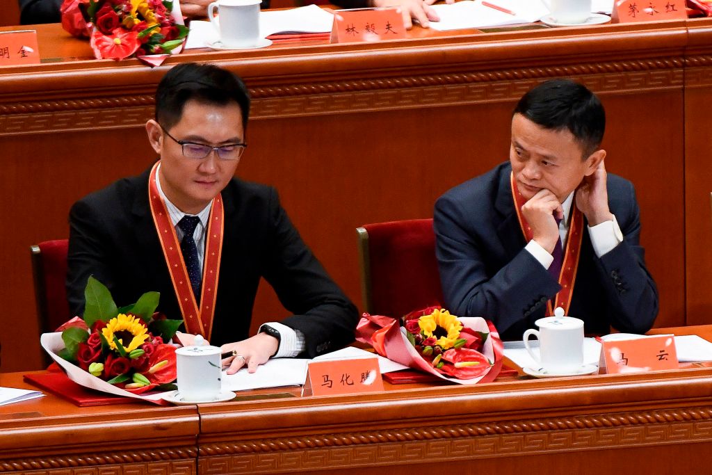 Tencent Holdings CEO Pony Ma (left) and Alibaba cofounder Jack Ma attend a meeting marking the 40th anniversary of China’s “reform and opening up” policy at the Great Hall of the People, in Beijing, on Dec. 18, 2018.