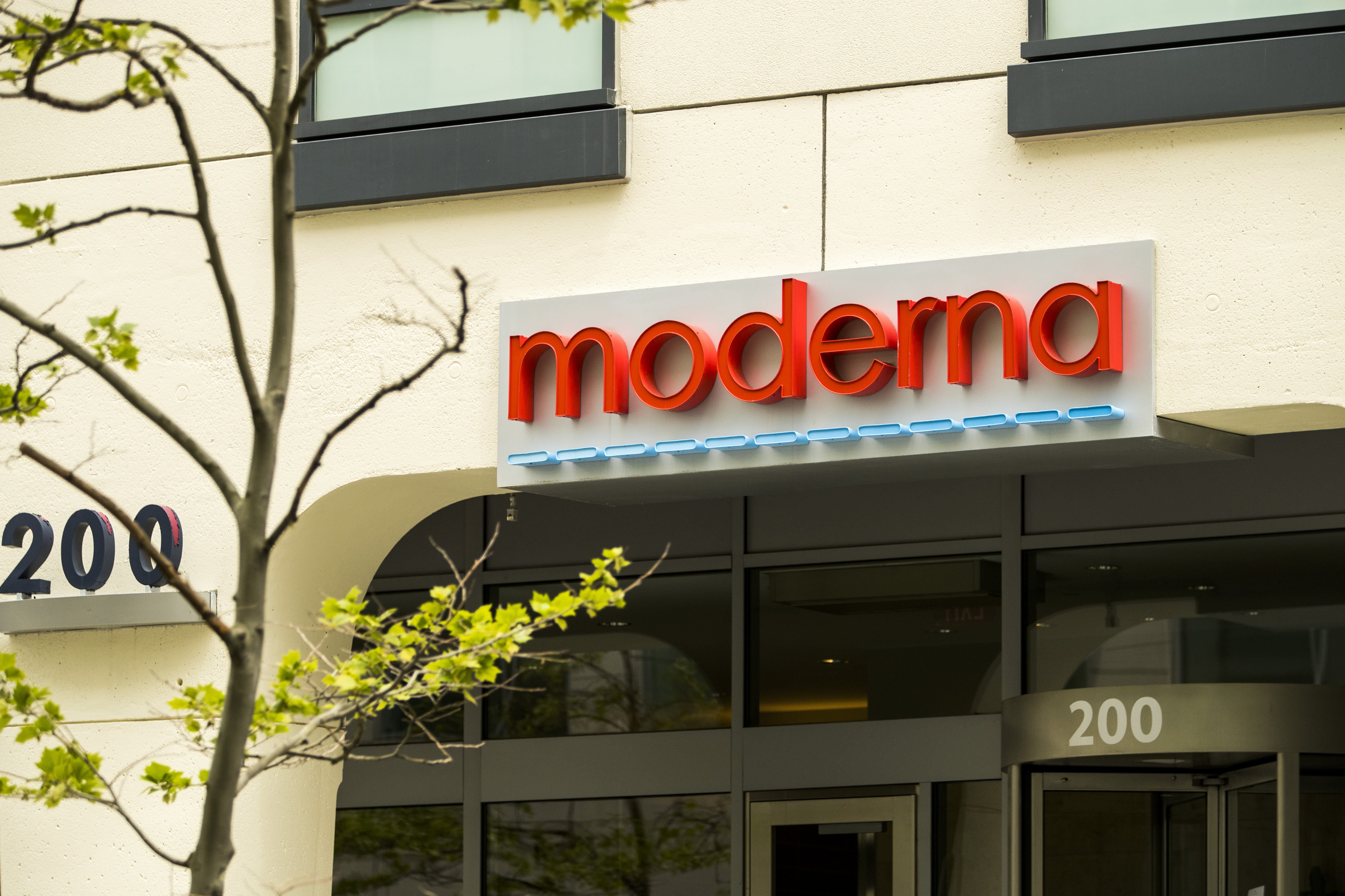 Signage is displayed on the Moderna Inc. headquarters in Cambridge, Massachusetts, U.S., on Monday, May 25, 2020. An experimental coronavirus vaccine from Moderna Inc. may wind up being good enough to be the first authorized inoculation, but is unlikely to be the best, an Evercore ISI analyst said.