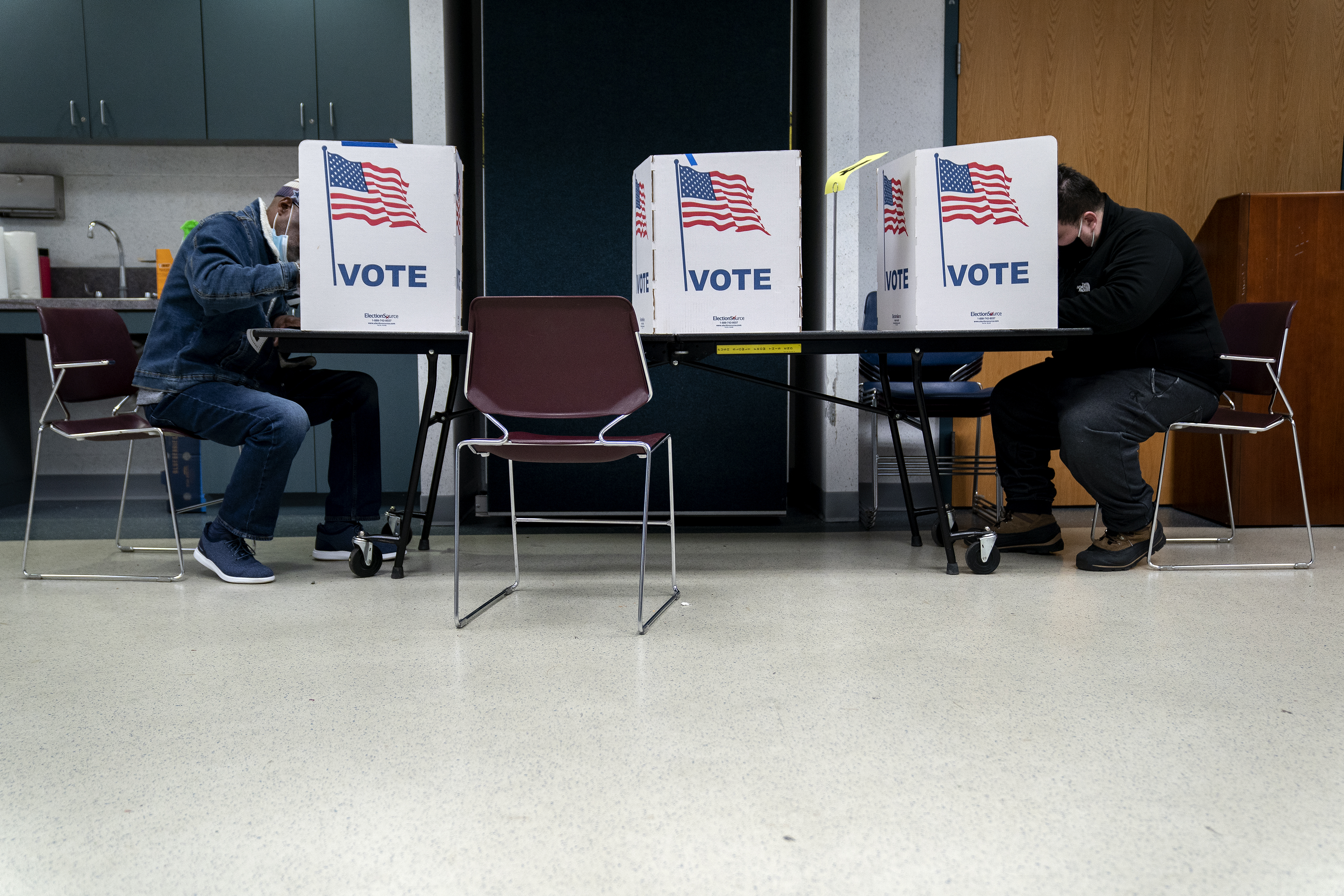 ALEXANDRIA, VA - OCTOBER 31: Voters fill out their ballots at an early voting center at the Mount Vernon Governmental Center on October 31, 2020 in Alexandria, Virginia. Today is the final day of early voting in Virginia, with voters waiting hours in line to cast their ballots ahead of the presidential election on Tuesday. (Photo by Stefani Reynolds/Getty Images)