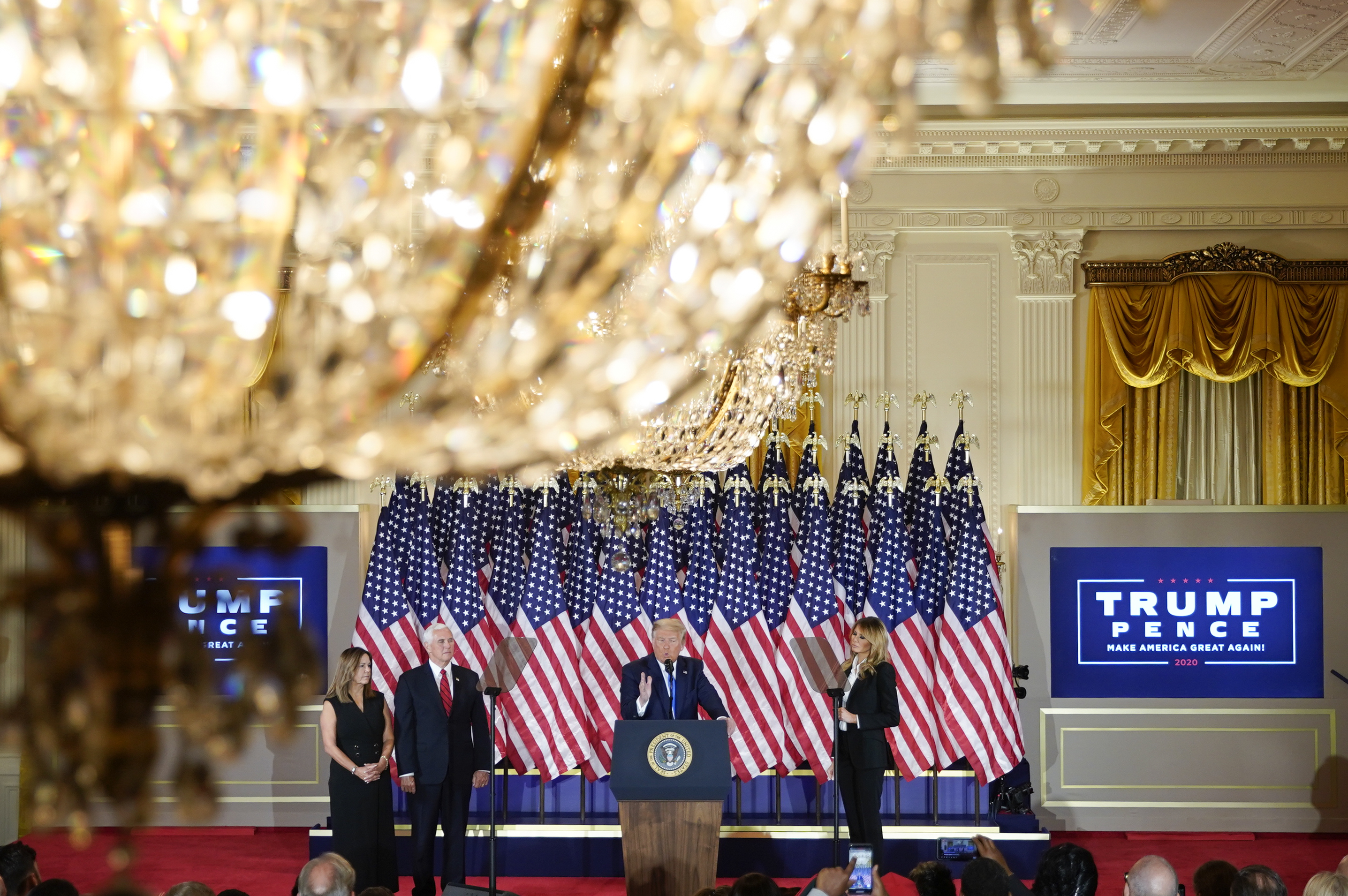 U.S. President Donald Trump, center, speaks during an election night party in the East Room of the White House in Washington, D.C., U.S., on Wednesday, Nov. 4, 2020. Trump declared he had won re-election against Joe Biden and said he would ask the Supreme Court to intervene, even as several battleground states continue to count votes. Photographer: Al Drago/Bloomberg via Getty Images