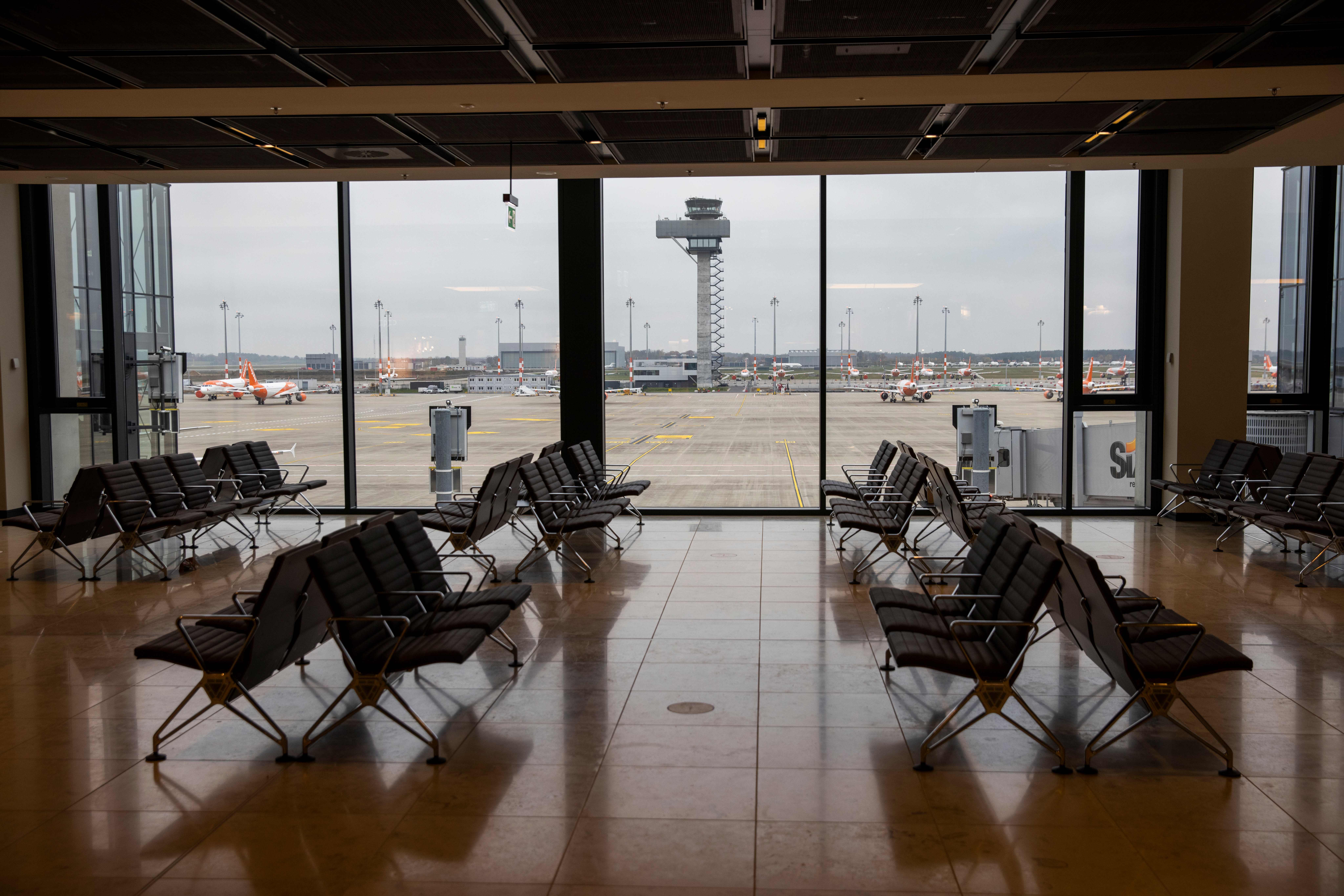 Empty seats are seen in terminal 1 at the "Berlin Brandenburg Airport Willy Brandt" in Schoenefeld, south-east of Berlin, on November 6, 2020. - British lowcost airline Easyjet announced on November 6, 2020, that it was reducing its flight capacity for the first quarter of 2021 to "at most 20%" of what it initially planned for this period, in reaction to the containment measures announced across Europe to combat the Covid-19 pandemic/