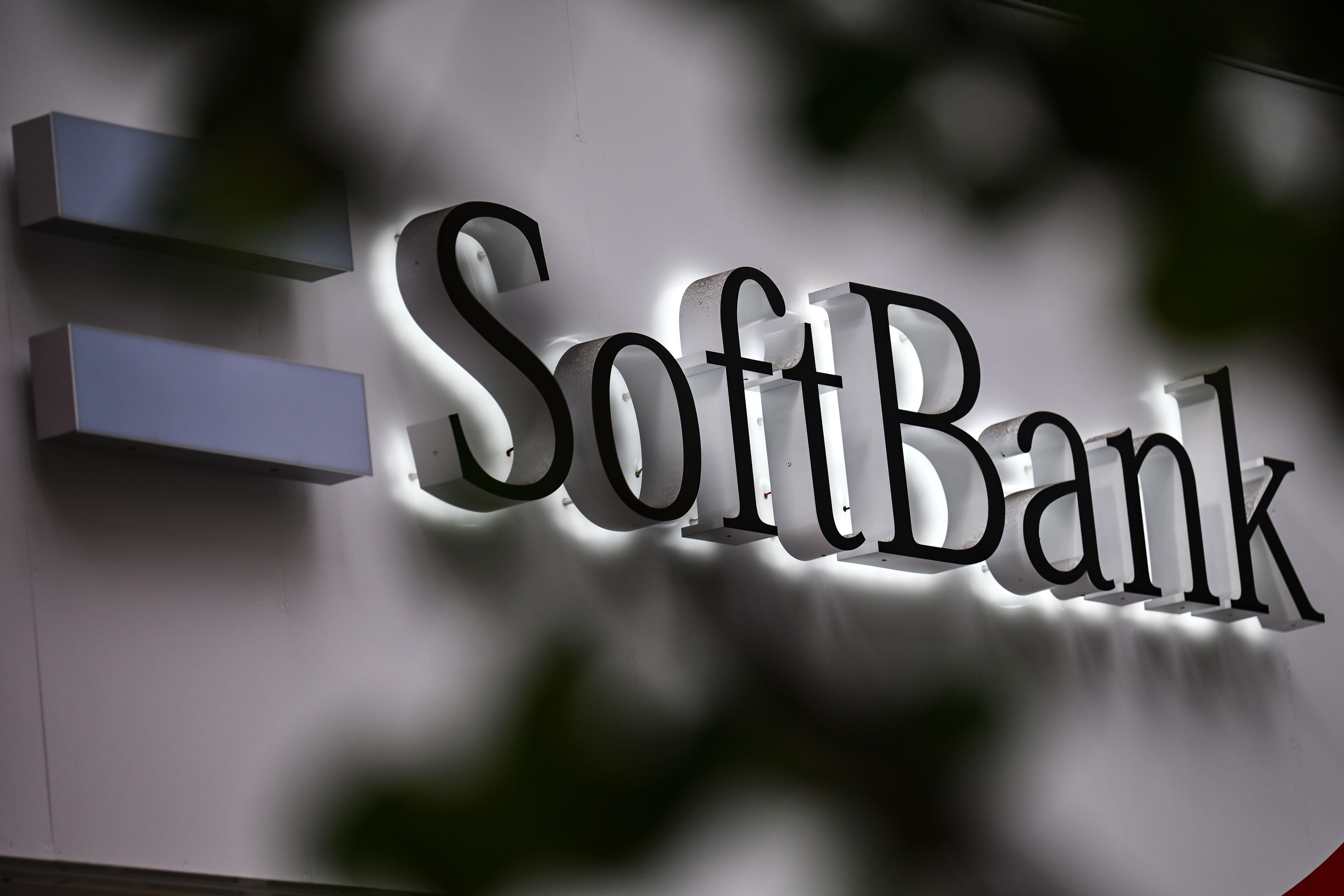 The SoftBank logo is seen at the entrance of a mobile shop in Tokyo on November 9, 2020.
