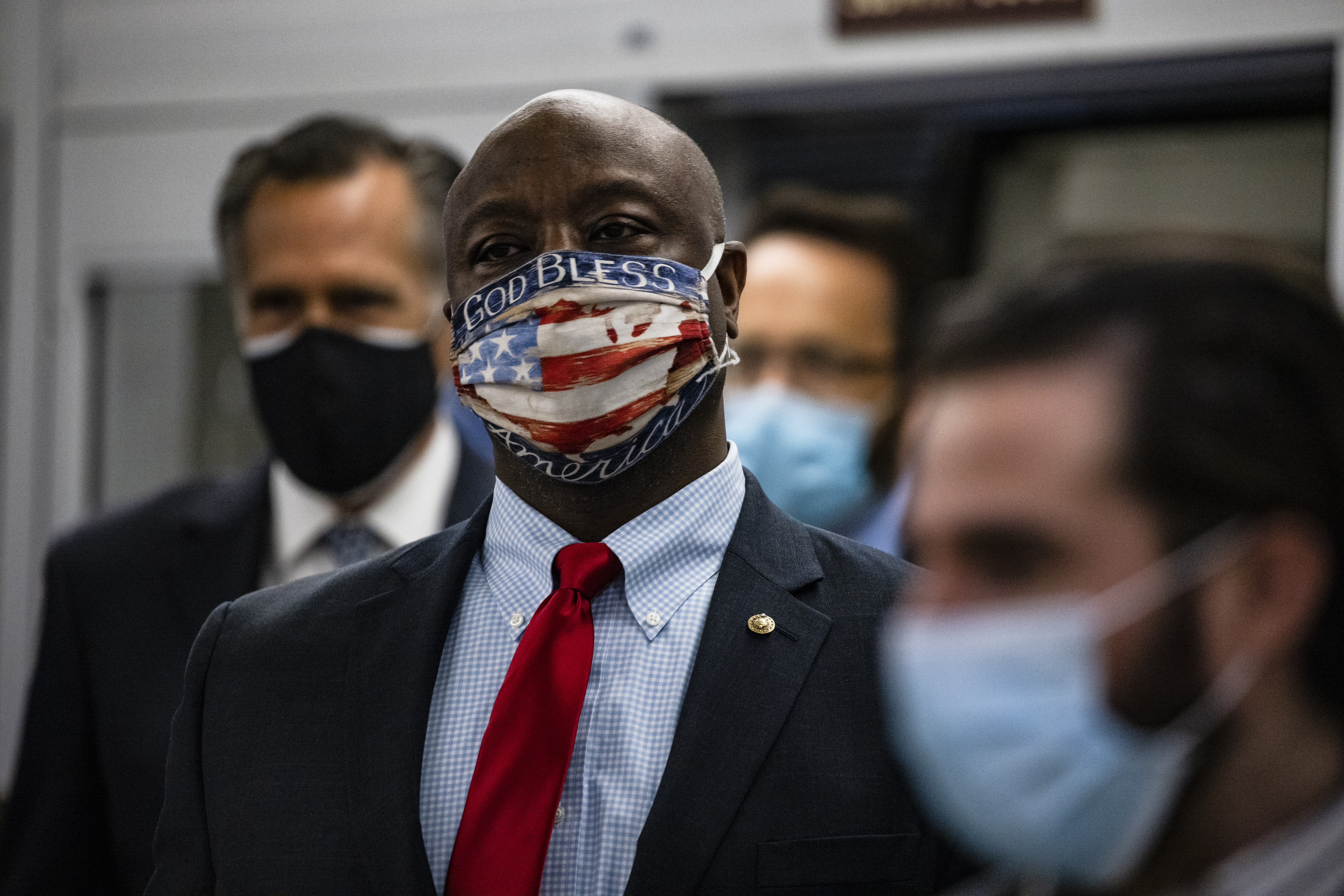 Senators Tim Scott (R-SC) (R) and Mitt Romney (R-UT) (L) step off the Senate subway on their way to a vote in the Senate at the U.S. Capitol on November 12, 2020 in Washington, DC. As President Trump continues to refuse to concede the Presidential Election to President-elect Joe Biden more Congressmen and women call for Biden to begin to receive classified national intelligence briefings from the Trump administration.
