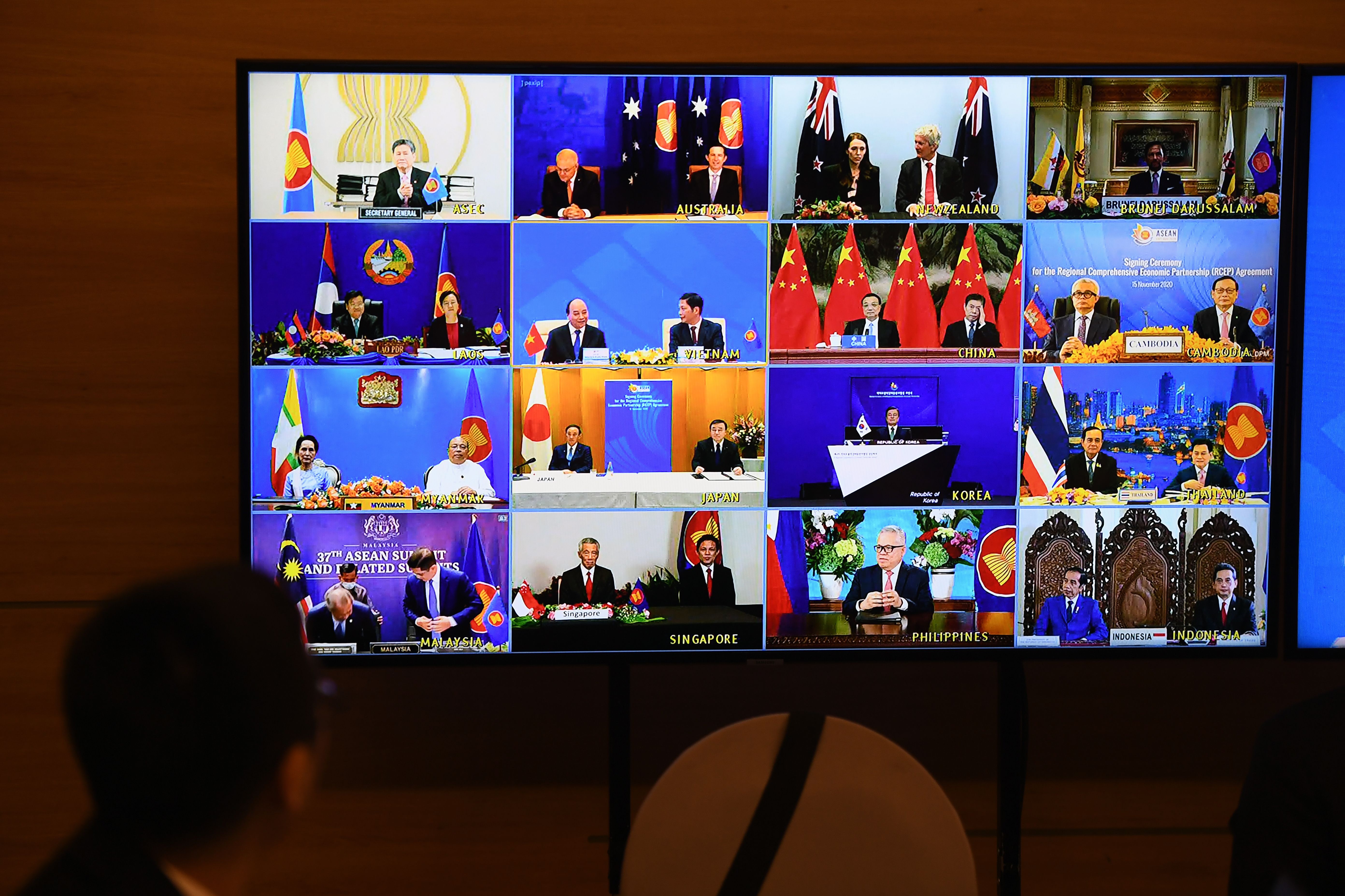 Representatives of signatory countries are pictured on-screen during the signing ceremony for the Regional Comprehensive Economic Partnership (RCEP) trade pact at the ASEAN summit held online in Hanoi, Vietnam, on Nov. 15, 2020.