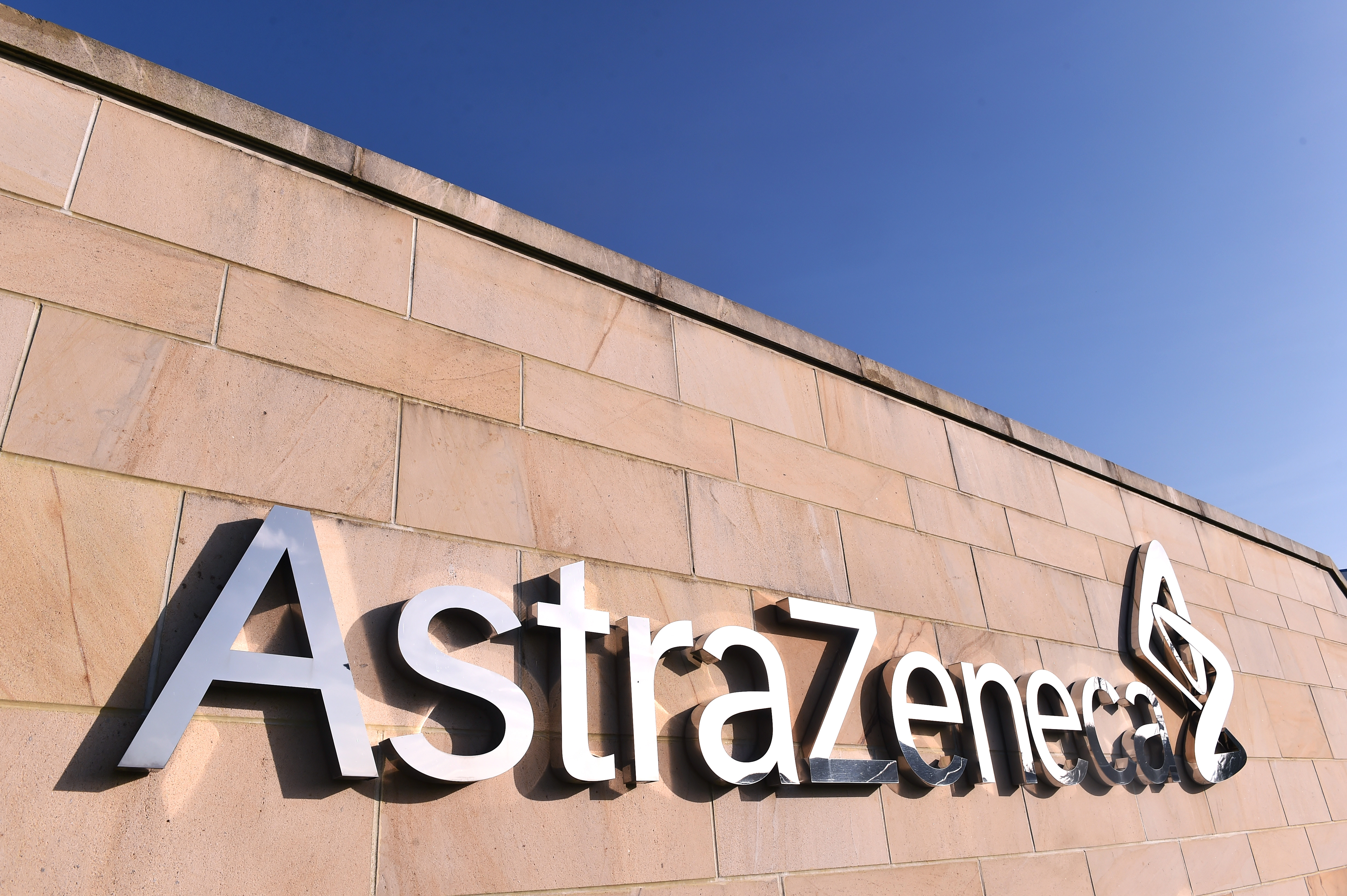 AstraZeneca was down in morning trade, but its announcement of promising COVID-19 vaccine trials is moving global markets.