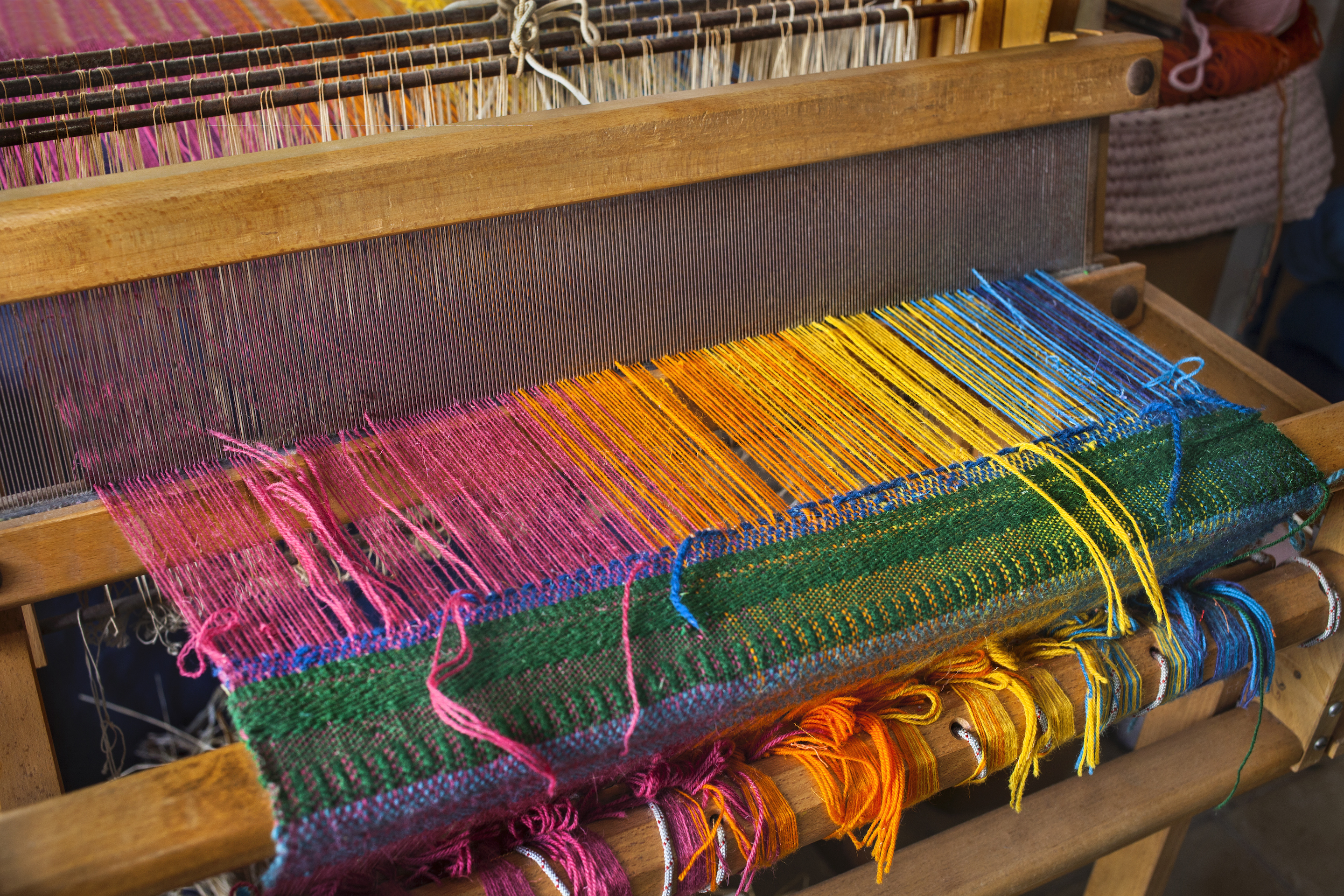 Textile loom for weaving
