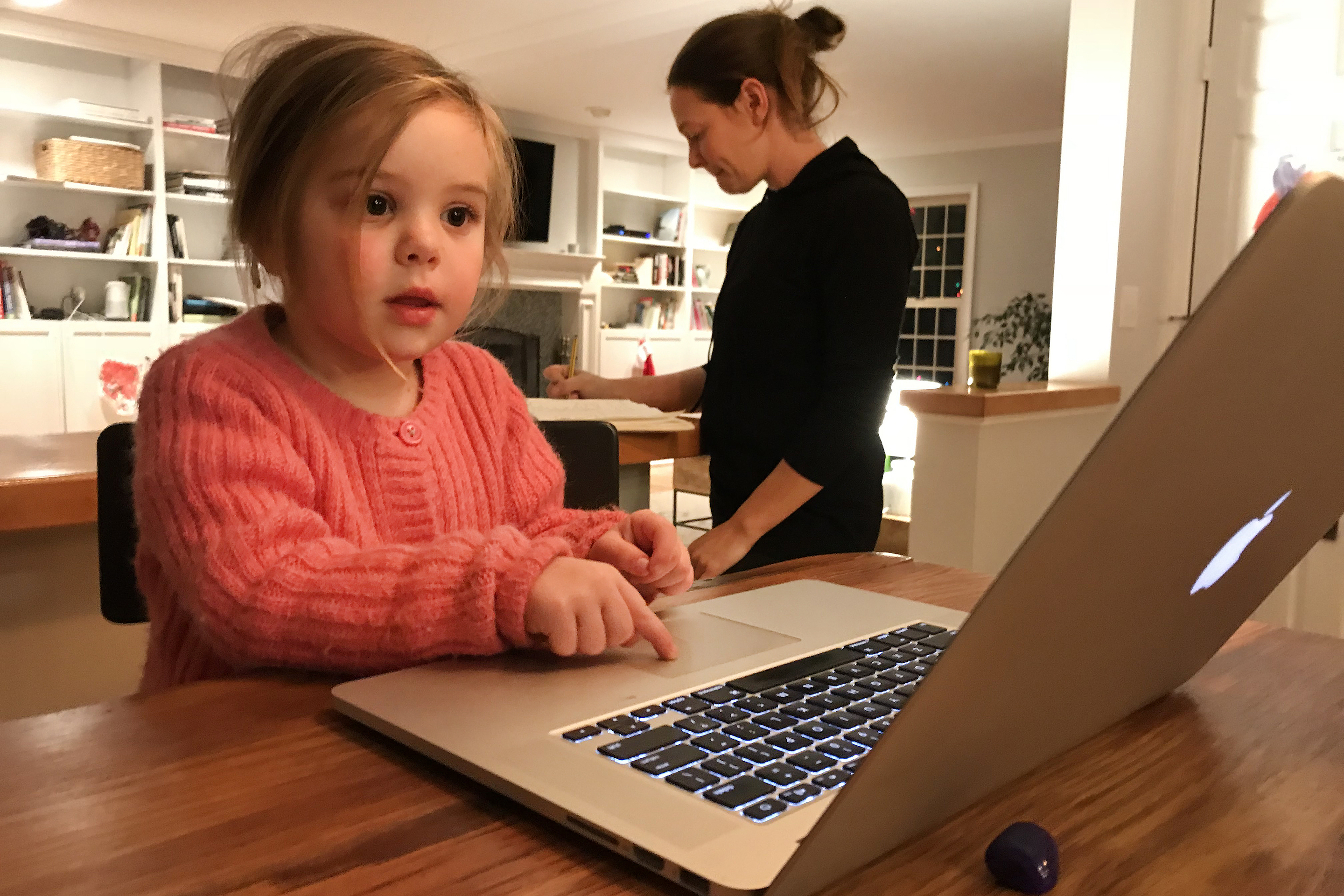 girl using macintosh laptop