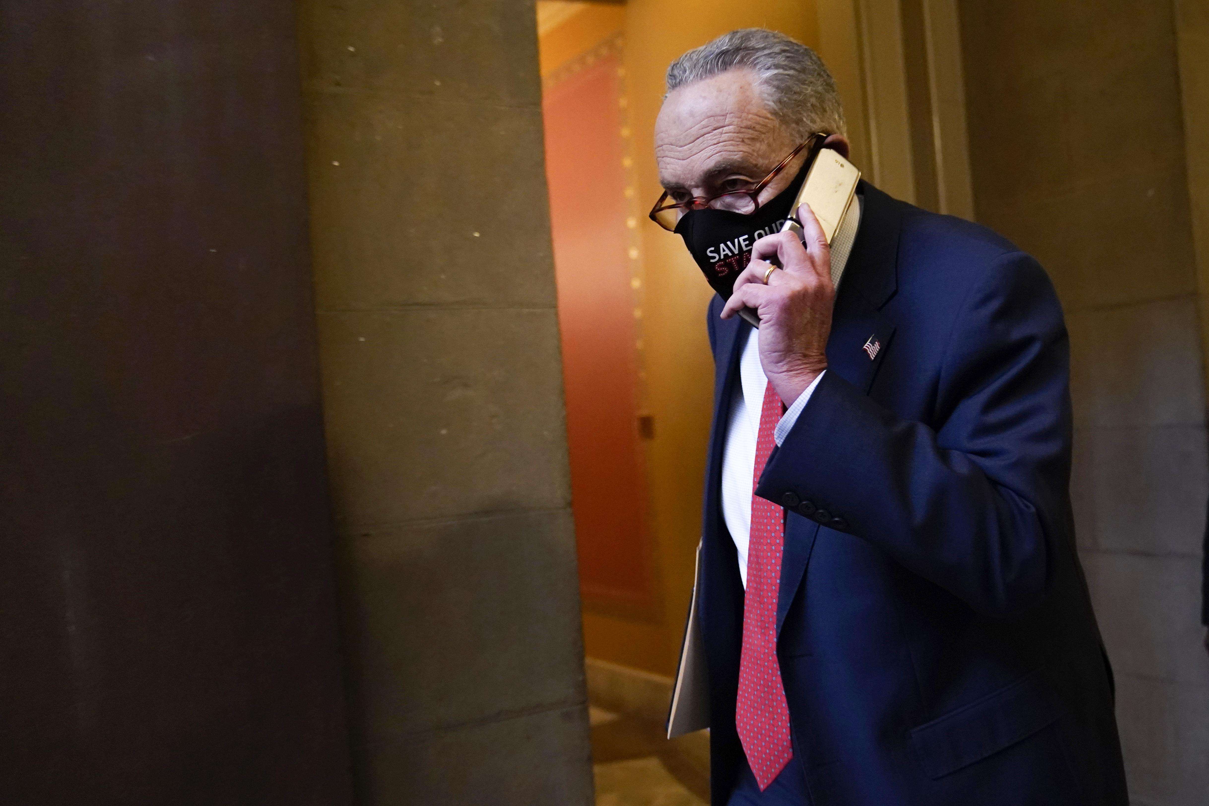 Senate Minority Leader Sen. Chuck Schumer of N.Y., walks on Capitol Hill in Washington, Tuesday, Dec. 15, 2020.
