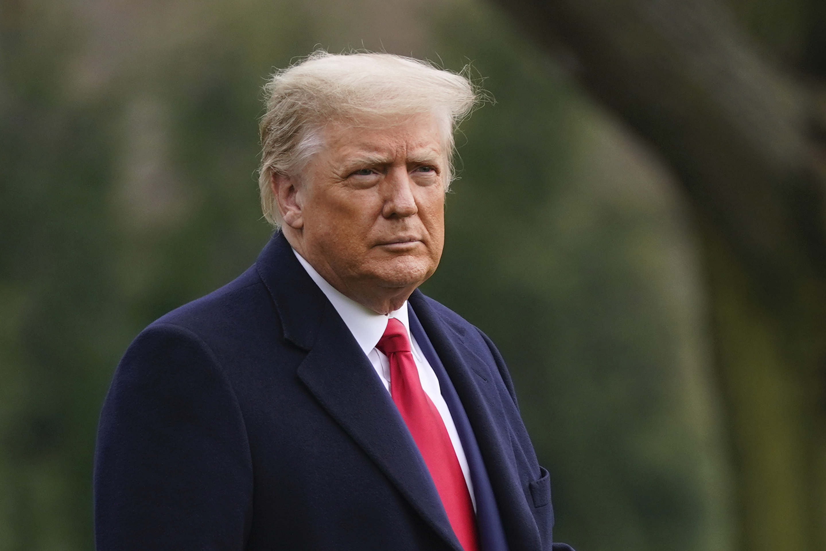 President Donald Trump walks on the South Lawn of the White House in Washington, D.C., on Dec. 12, 2020, before boarding Marine One.