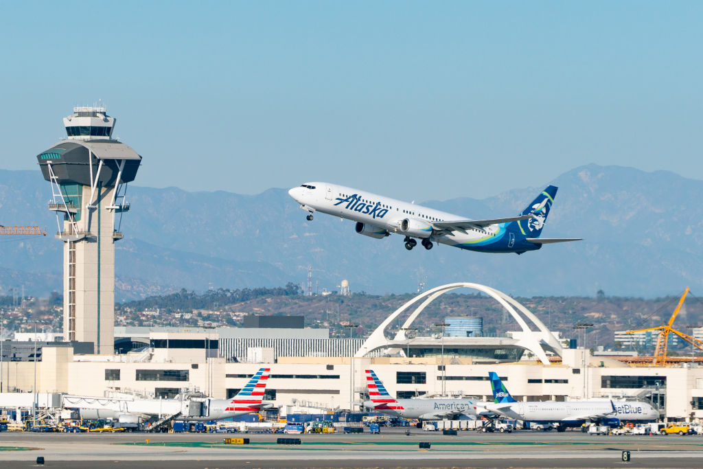 A Alaska Airlines Boeing 737-990 takes off from Los Angeles International Airport on November 11, 2020 in Los Angeles, Calif.