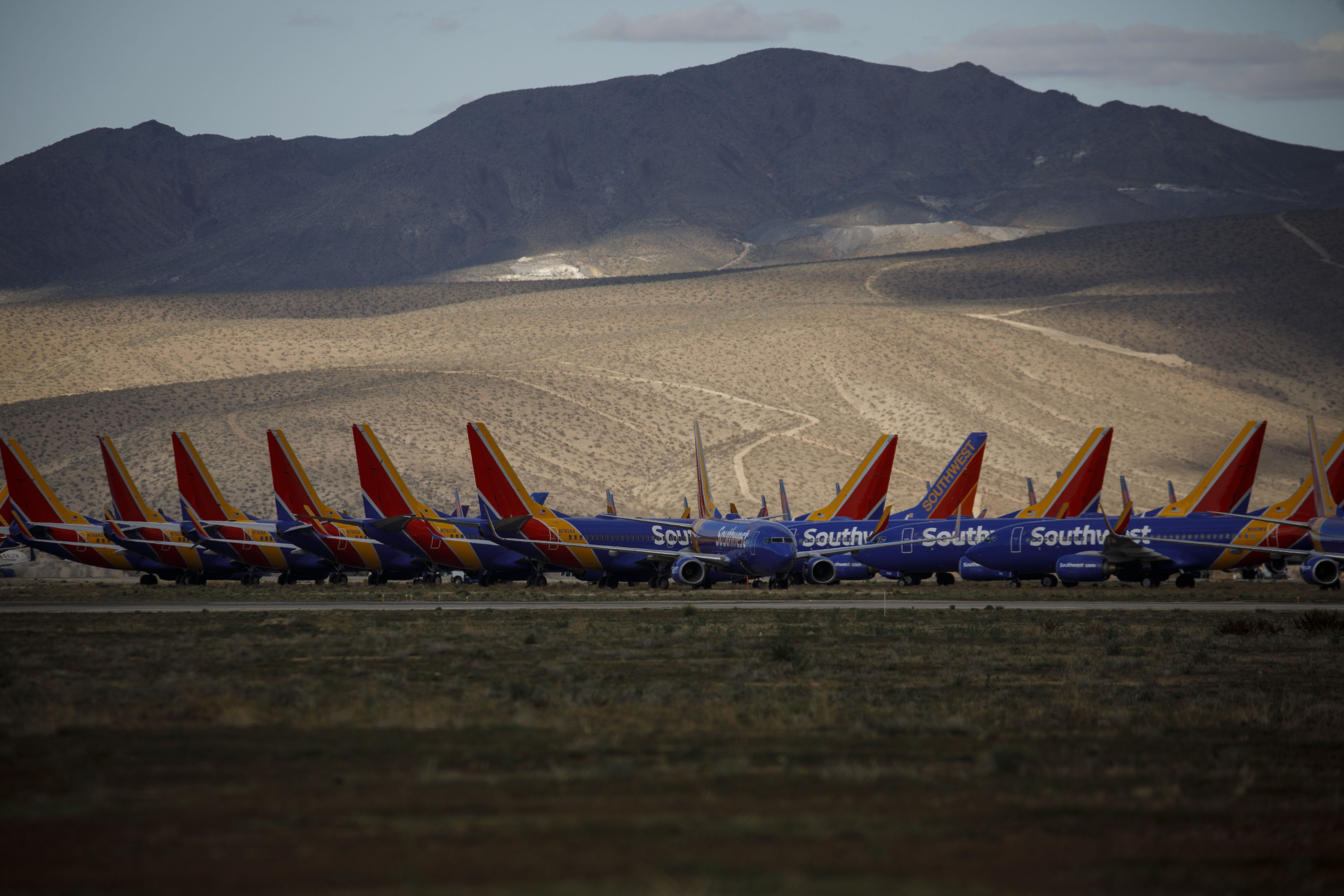 Southwest Airlines Co. aircraft sit in storage during the Covid-19 pandemic at a field in Victorville, California, U.S., on Monday, March 23, 2020. 