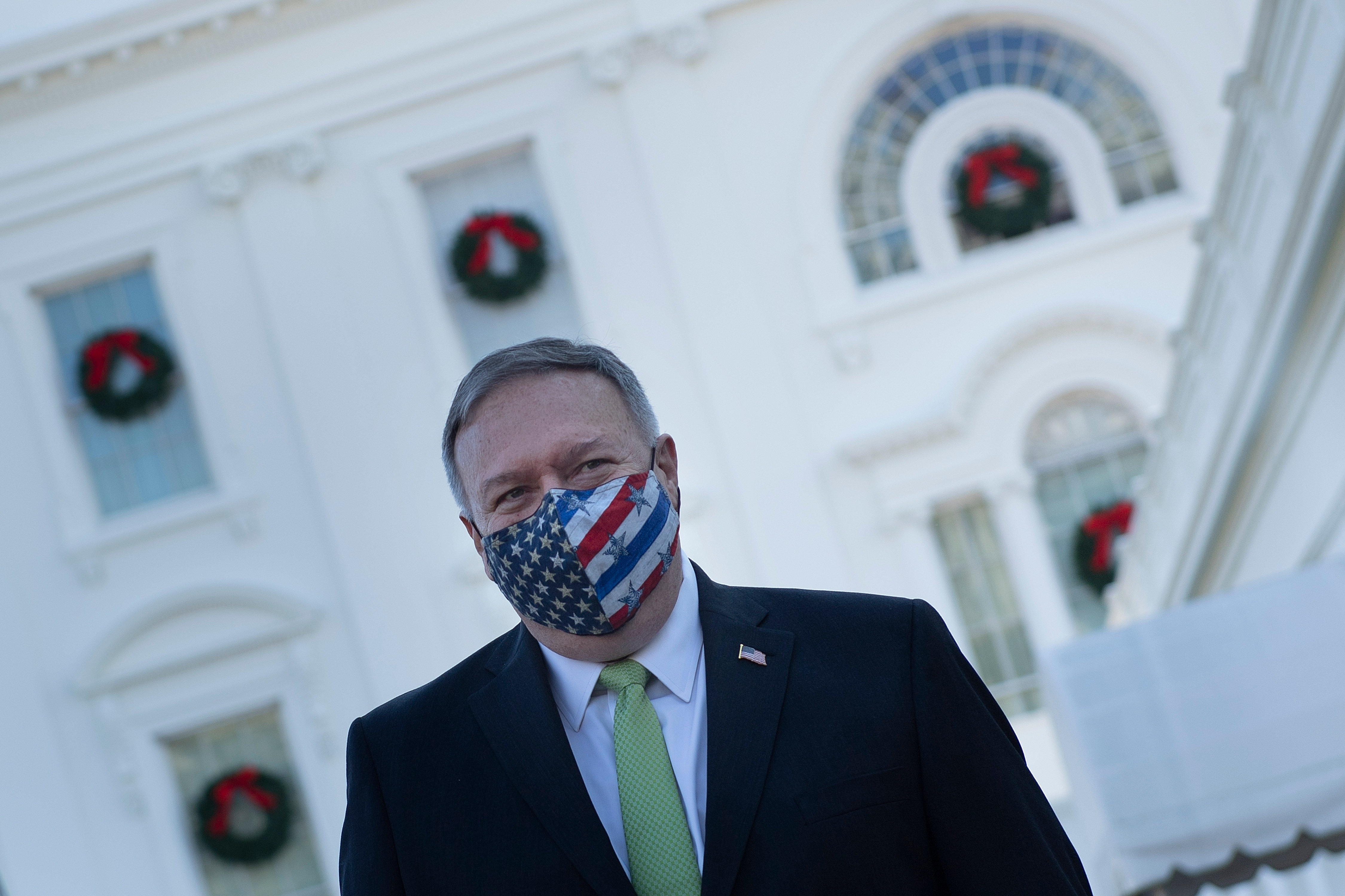 Secretary of State Mike Pompeo outside the White House on Dec. 11. Pompeo said in a radio interview on Friday that Russia was 'pretty clearly' behind a massive cyberattack on government and business.