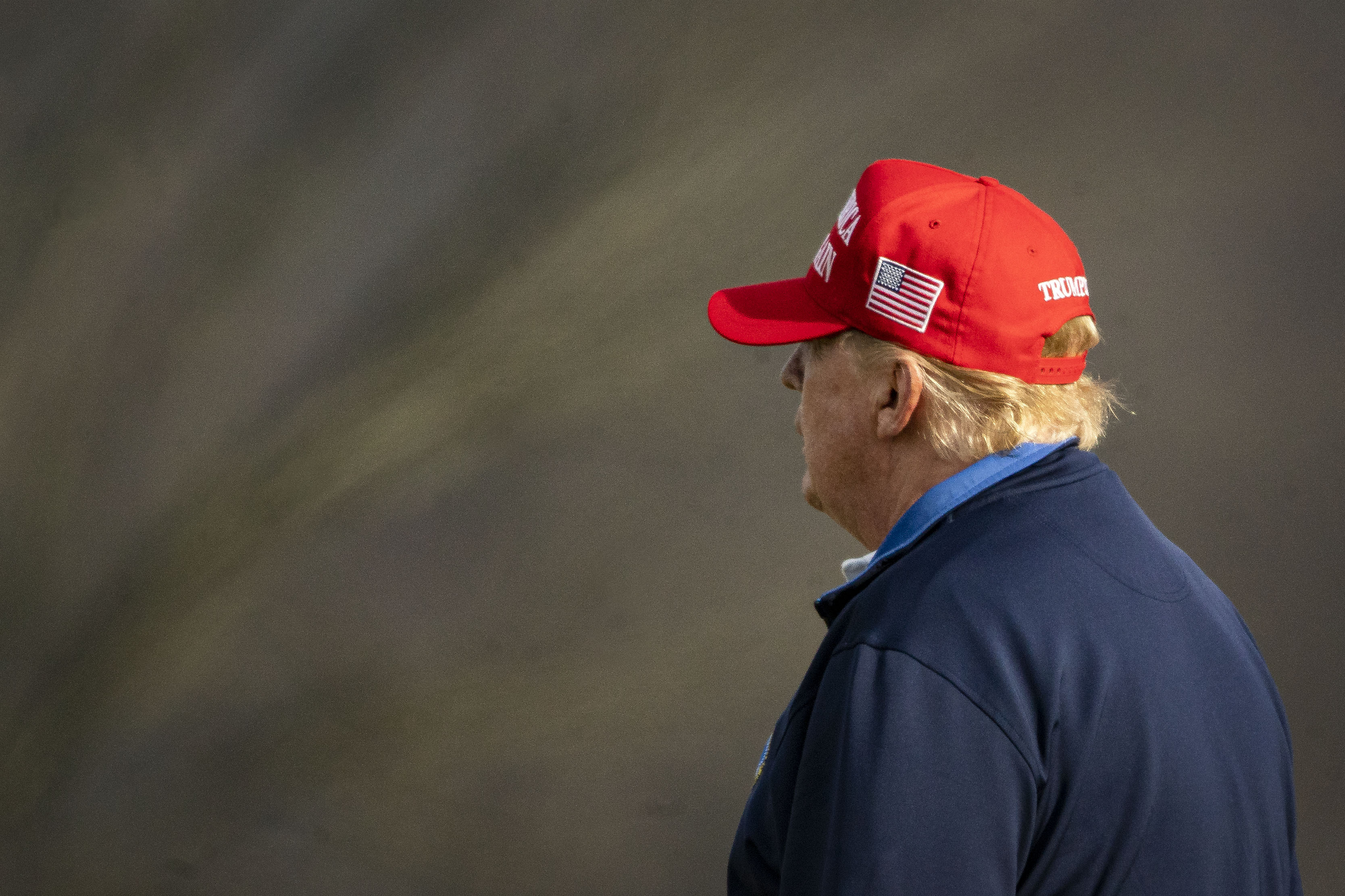 U.S. President Donald Trump golfs at Trump National Golf Club on December 13, 2020 in Sterling, Virginia. The President has now imperiled a nonpartisan stimulus package.