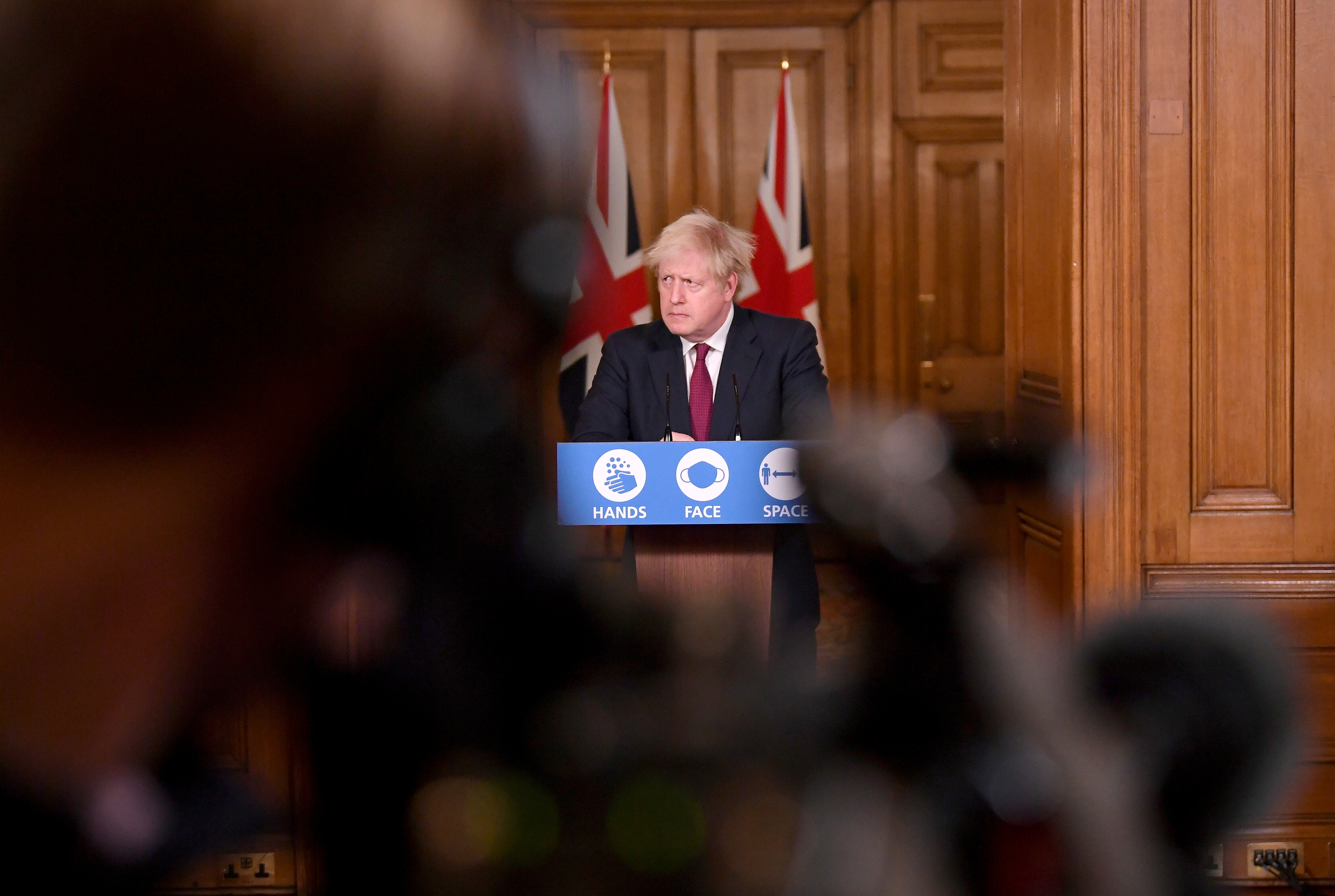 LONDON, ENGLAND - DECEMBER 19: Britain's Prime Minister Boris Johnson speaks during a news conference in response to the ongoing situation with the coronavirus disease (COVID-19) pandemic, inside 10 Downing Street on December 19, 2020 in London, England. The Prime Minister announces tier four restrictions for London and the South East.