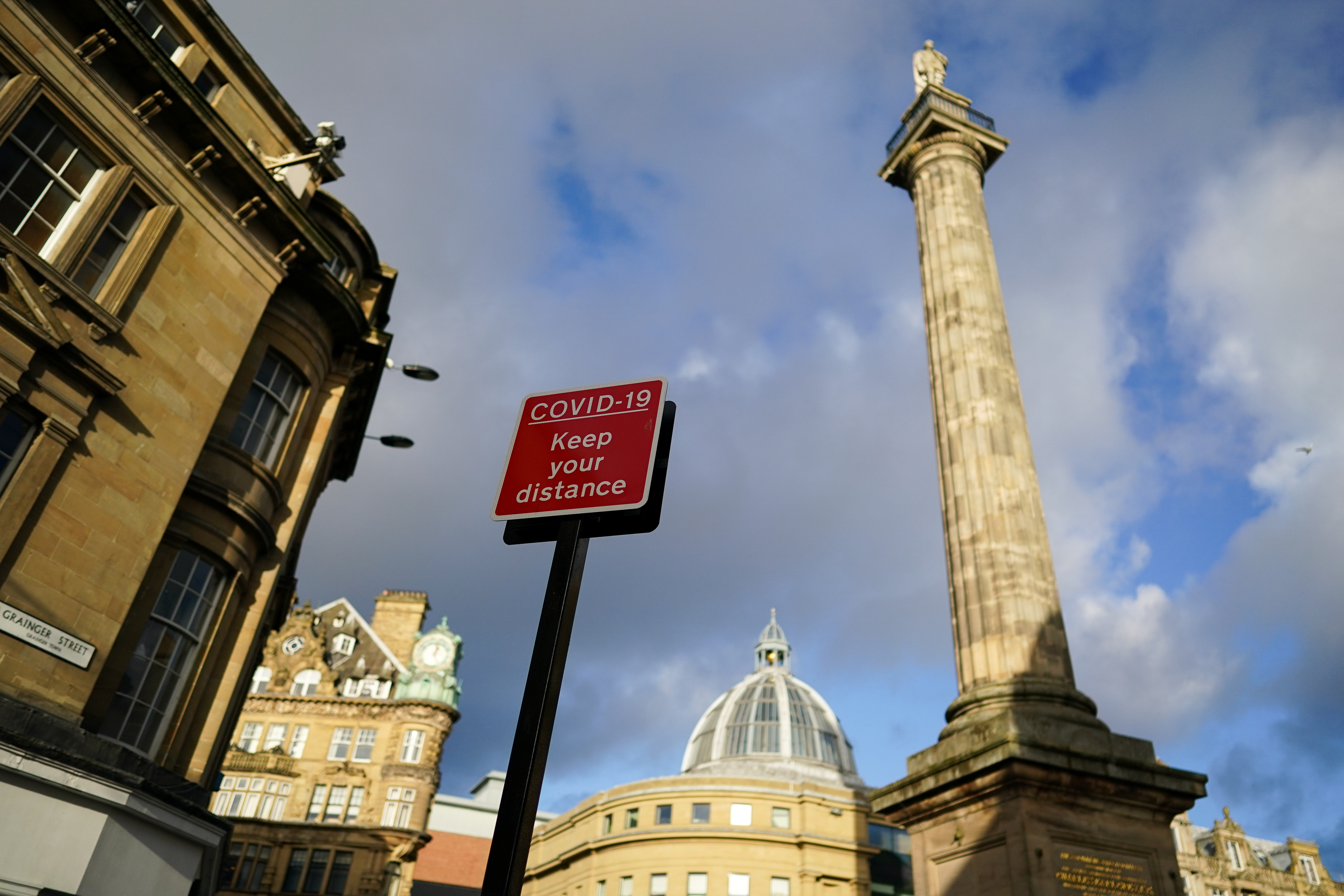A COVID warning sign is displayed in Newcastle city centre on Dec. 2, 2020, in Newcastle upon Tyne, England. Today is the first day of the new Tier system introduced at the end of the second coronavirus lockdown to prevent further spread of the coronavirus. Newcastle has been put into Tier 3 restrictions.