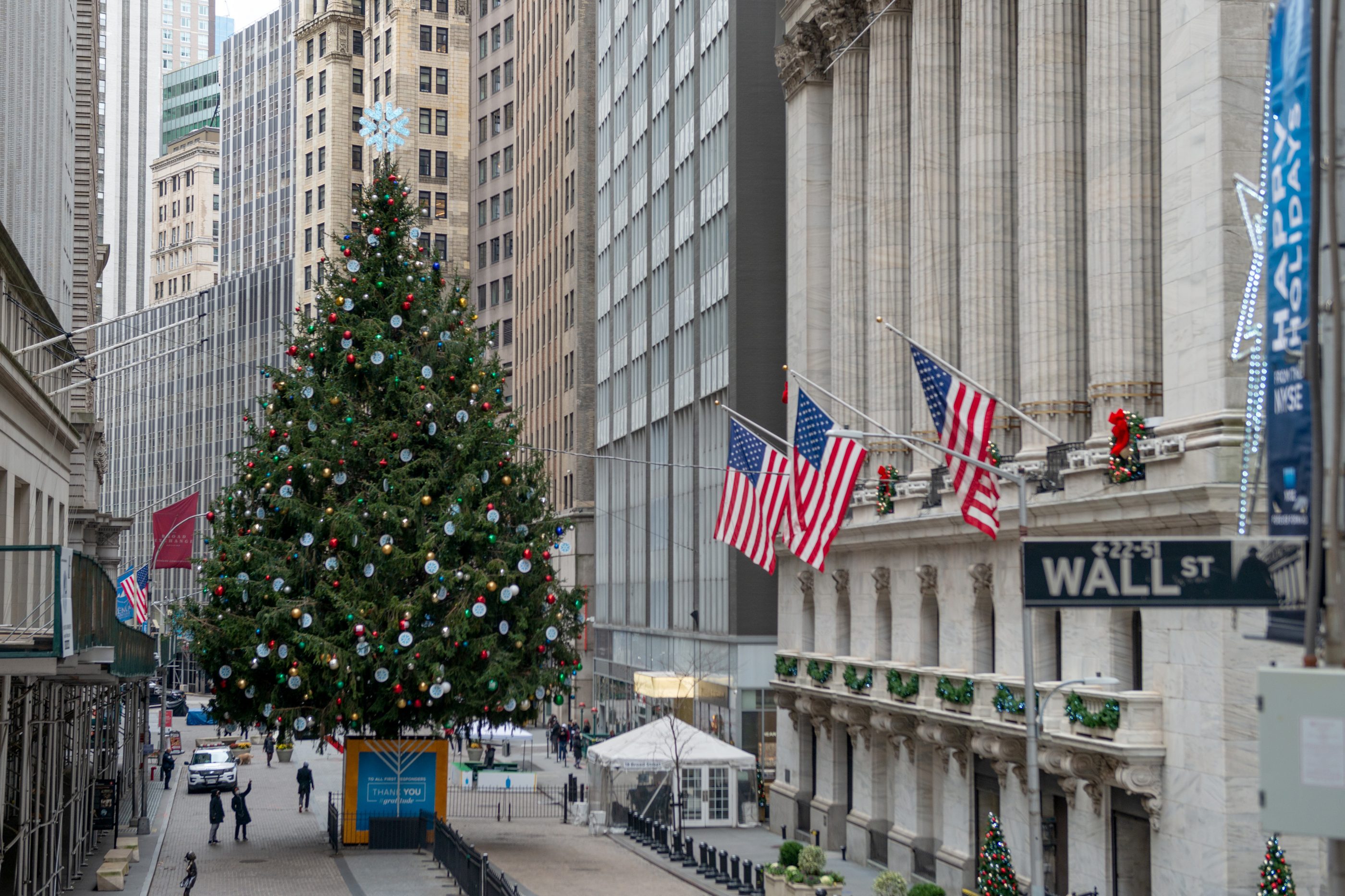 A large Christmas tree is displayed in front of the New York Stock Exchange for the holiday season.