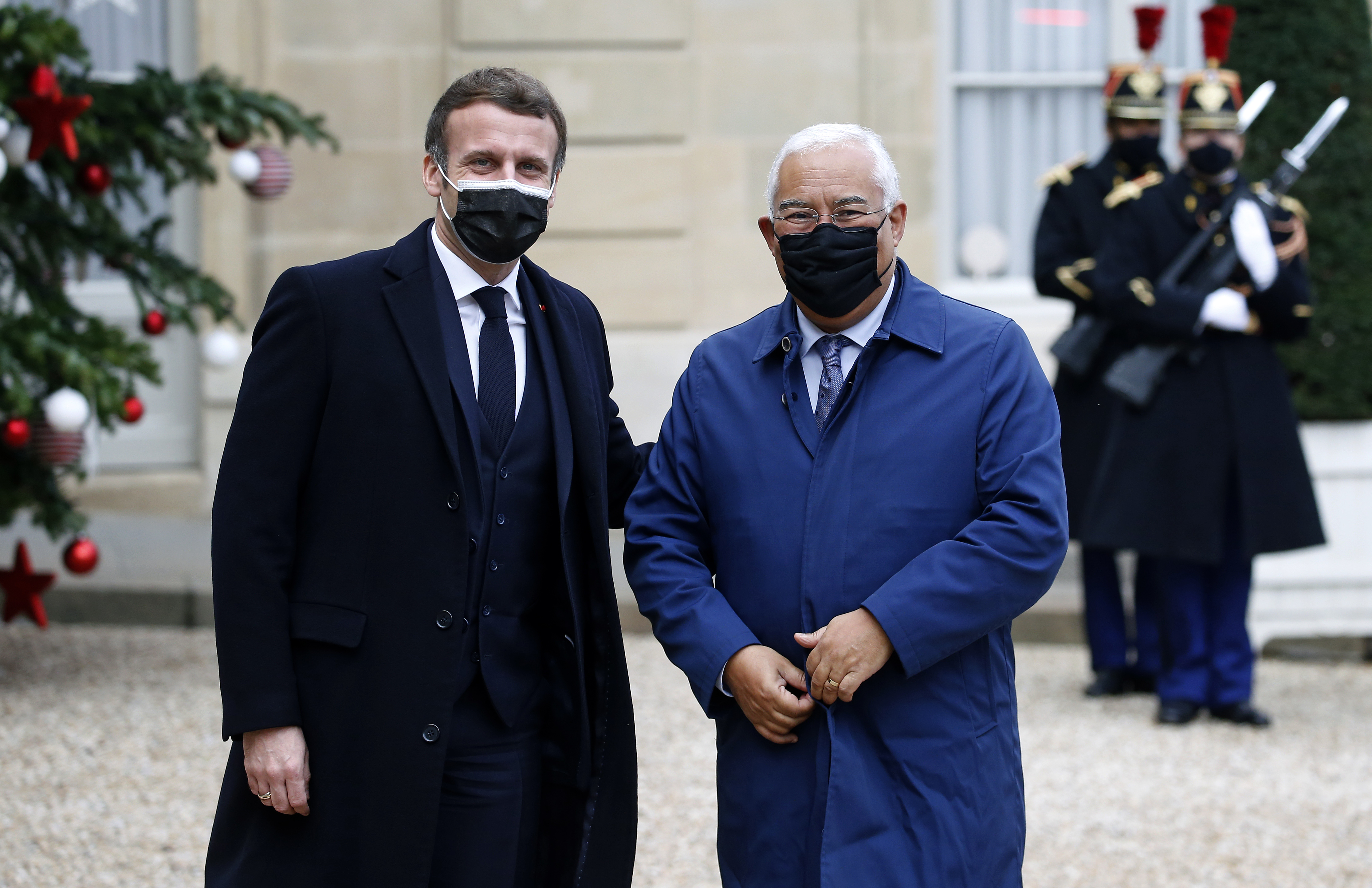 Emmanuel Macron (left) welcomes Portugal’s Prime Minister, Antonio Costa, at the Elysée Palace on Tuesday. The French President tested positive for COVID, and now Europe’s leaders are scrambling to contain the outbreak. (Wire photography: Chesnot—Getty Images)
