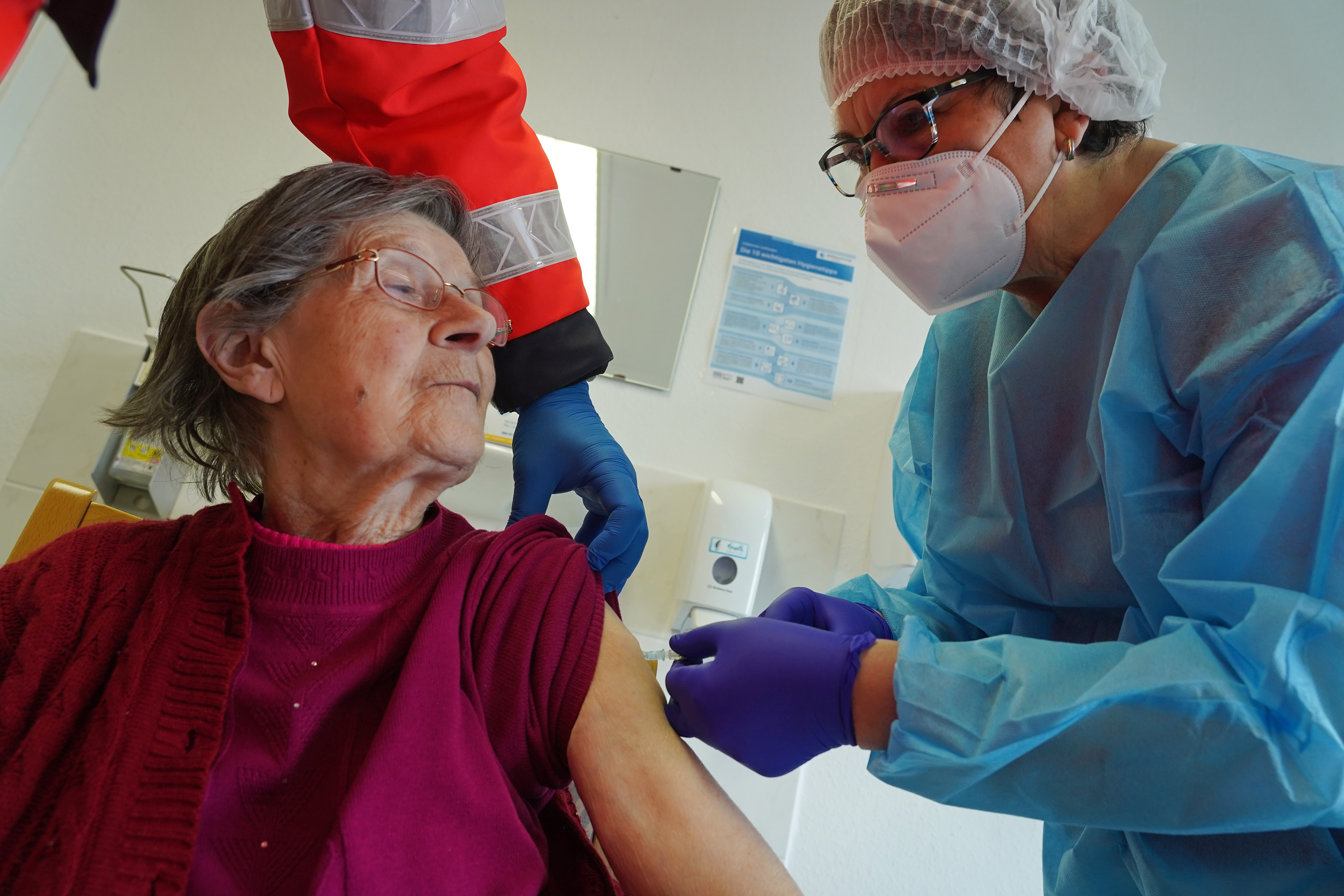 Brigitte Klausch, 88, receives the Pfizer/BioNTech vaccine at a nursing home of the German Red Cross (DRK) on the first day of the E.U.-wide launch of COVID-19 vaccinations on December 27, 2020 in Grossraeschen, Germany. The volume of delivered vaccine is to rise sharply next week.