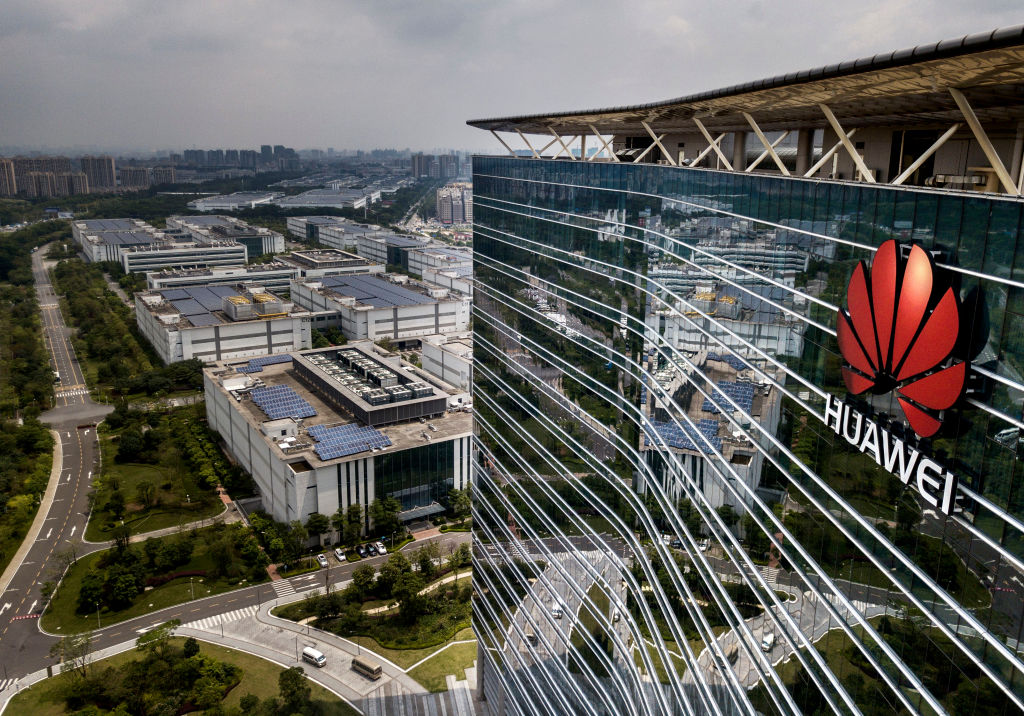 The Huawei logo is seen on the side of the main building at the company's production campus on April 25, 2019 in Dongguan, near Shenzhen, China.