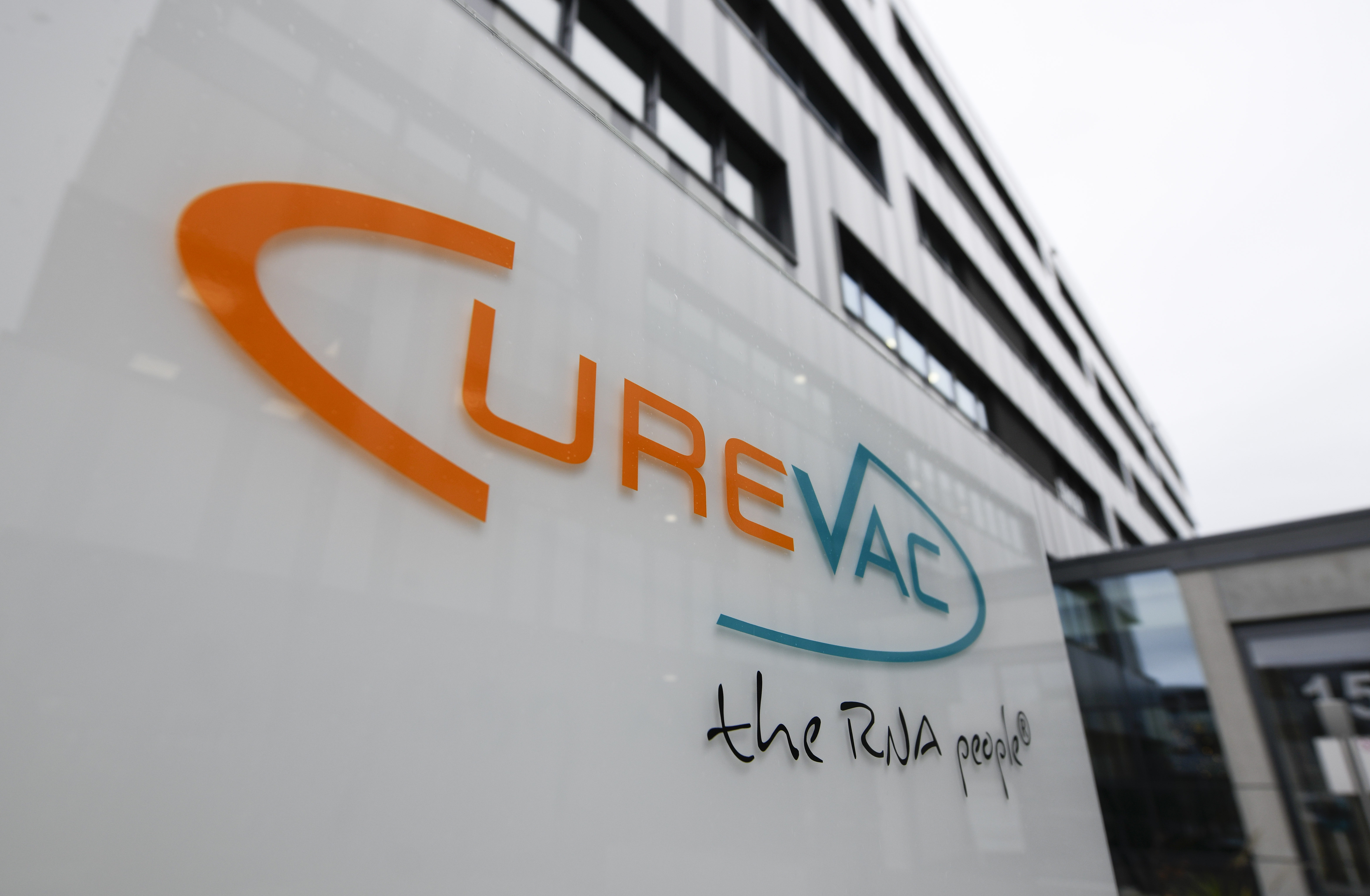 The logo of the biopharmaceutical company CureVac, is displayed in front of the company's headquarters in Tuebingen, southern Germany on December 15, 2020.