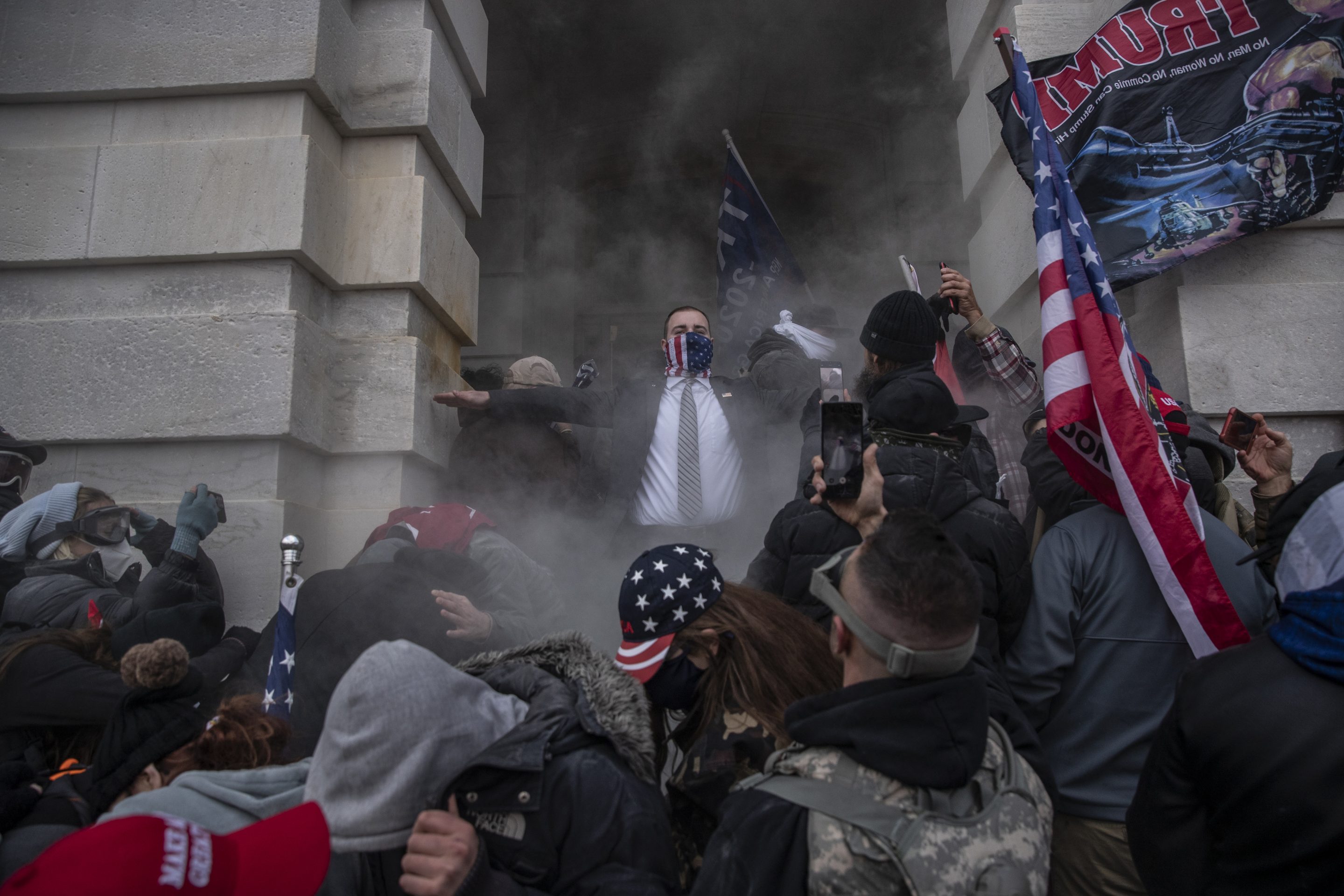 Demonstrators attempt to breach the U.S. Capitol after they earlier stormed the building in Washington, D.C. on Wednesday, Jan. 6, 2021. 