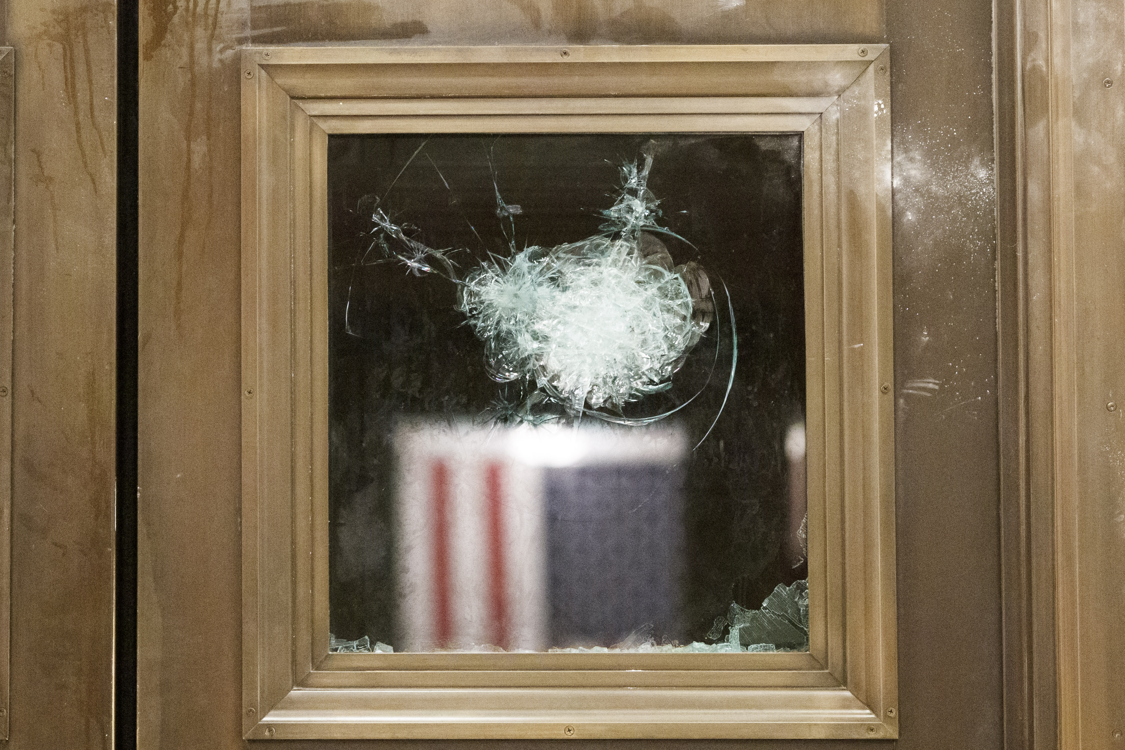 A damaged door inside the U.S. Capitol in Washington, D.C., on Jan. 6, 2021. The House and Senate resumed a politically charged debate over the legitimacy of the presidential election hours after a pro-Trump mob stormed the U.S. Capitol and drove lawmakers from their chambers.