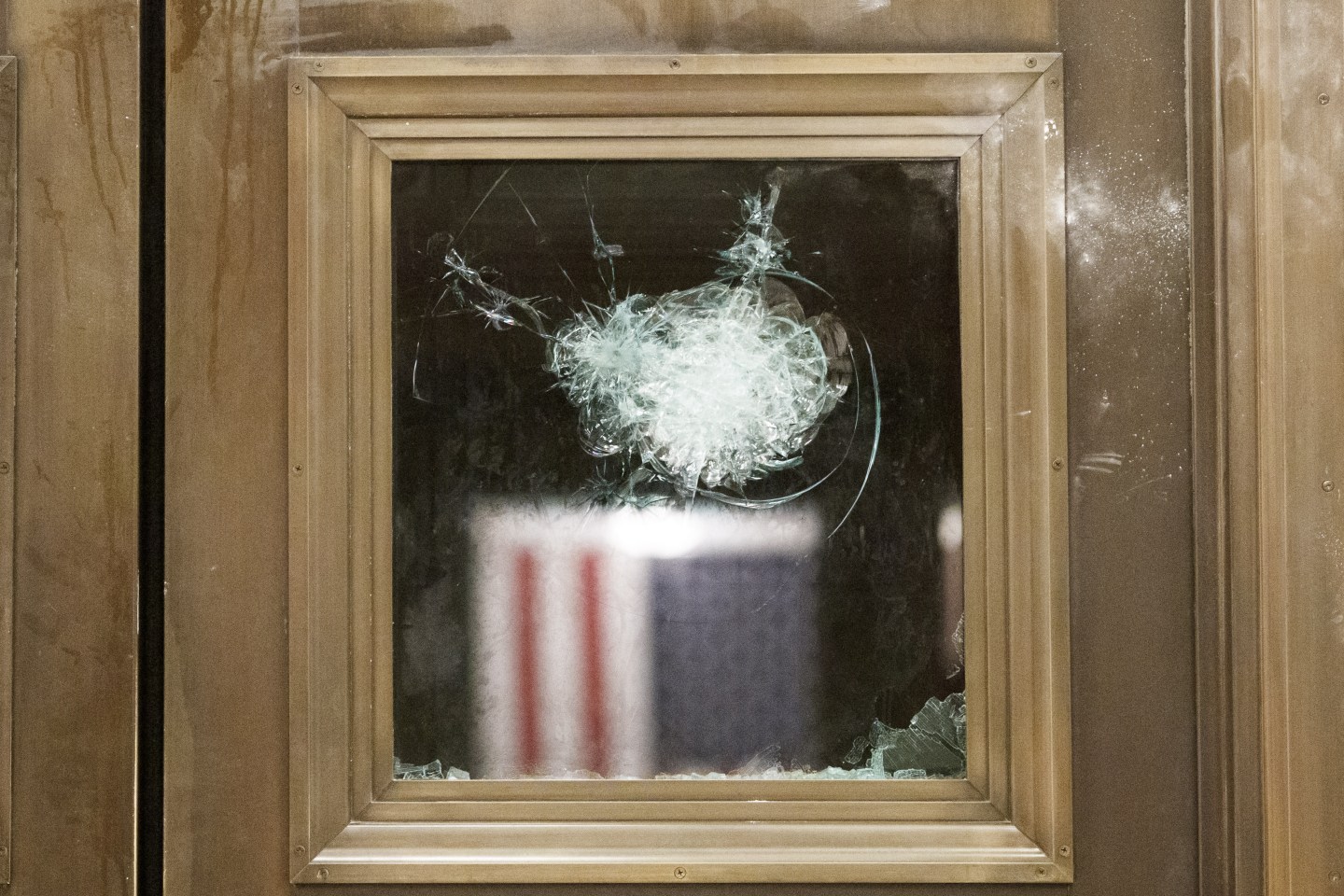 A damaged door inside the U.S. Capital in Washington D.C., U.S., on Wednesday, Jan. 6, 2021. The House and Senate resumed a politically charged debate over the legitimacy of the presidential election hours after a pro-Trump mob stormed the U.S. Capitol and drove lawmakers from their chambers.