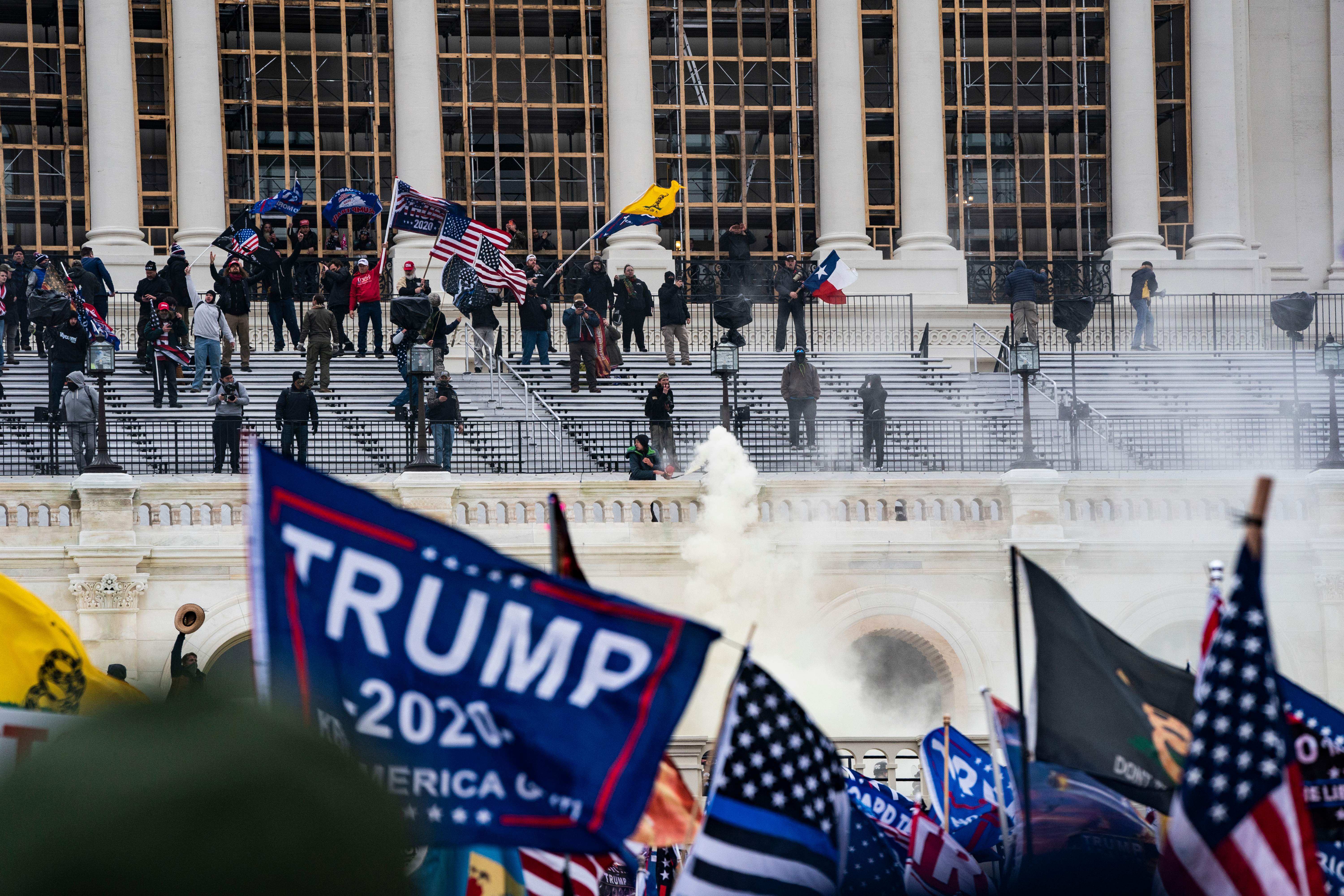 Supporters of US President Donald Trump clash with the US Capitol police during a riot at the US Capitol on January 6, 2021, in Washington, DC.