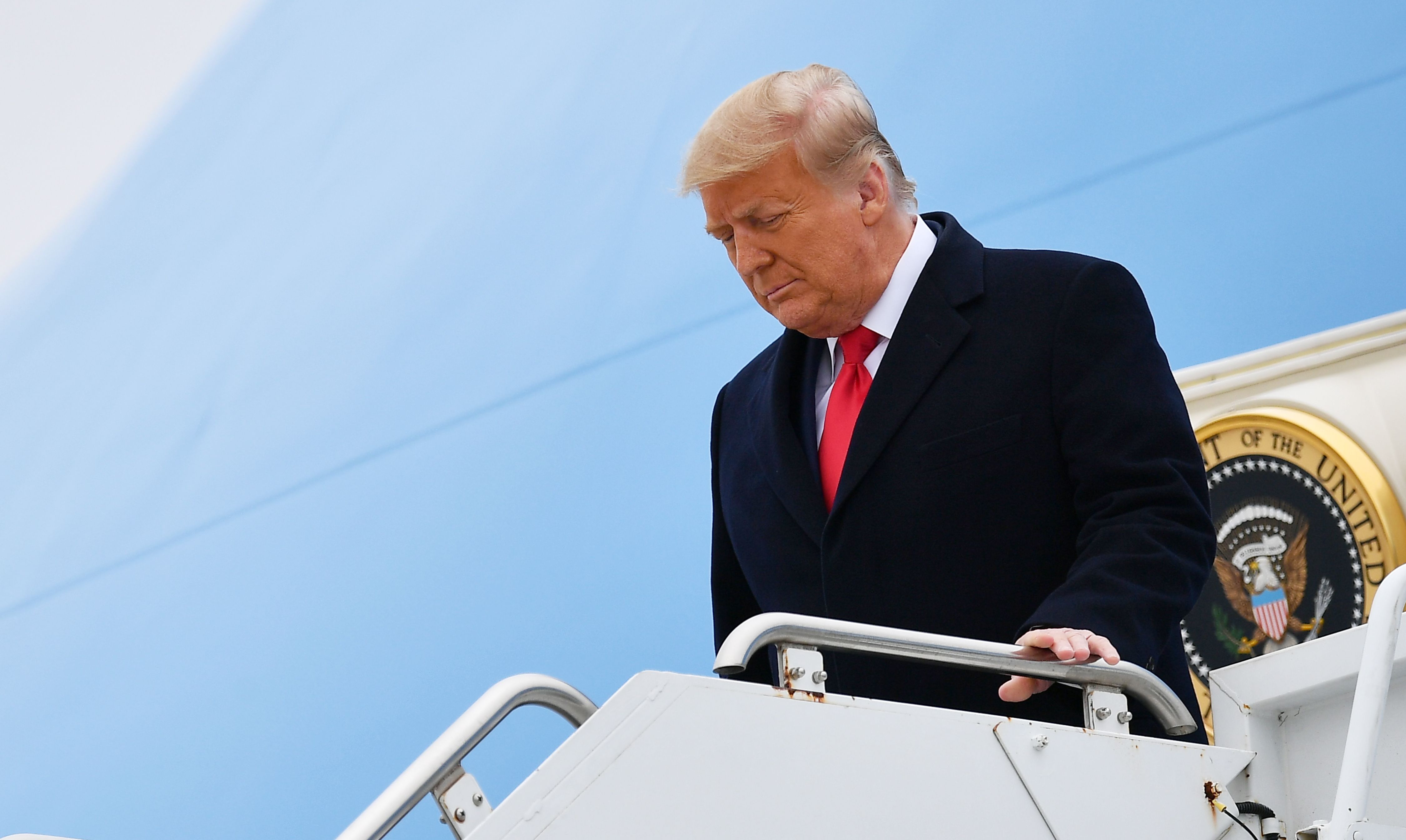 US President Donald Trump stepping off Air Force One upon arrival in Harlingen, Texas, on January 12, 2021. Trump faces a raft of legal challenges when he leaves office on Wednesday.
