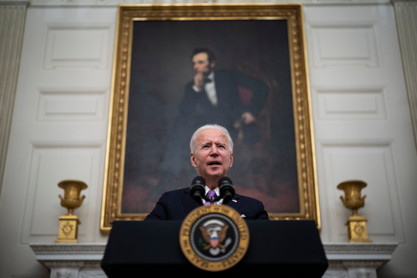 President Joe R. Biden, with Vice President Kamala Harris by his side, speaks about the COVID-19 coronavirus pandemic before signing executive orders in the State Dining Room at the White House on Thursday, Jan 21, 2021 in Washington, DC.
