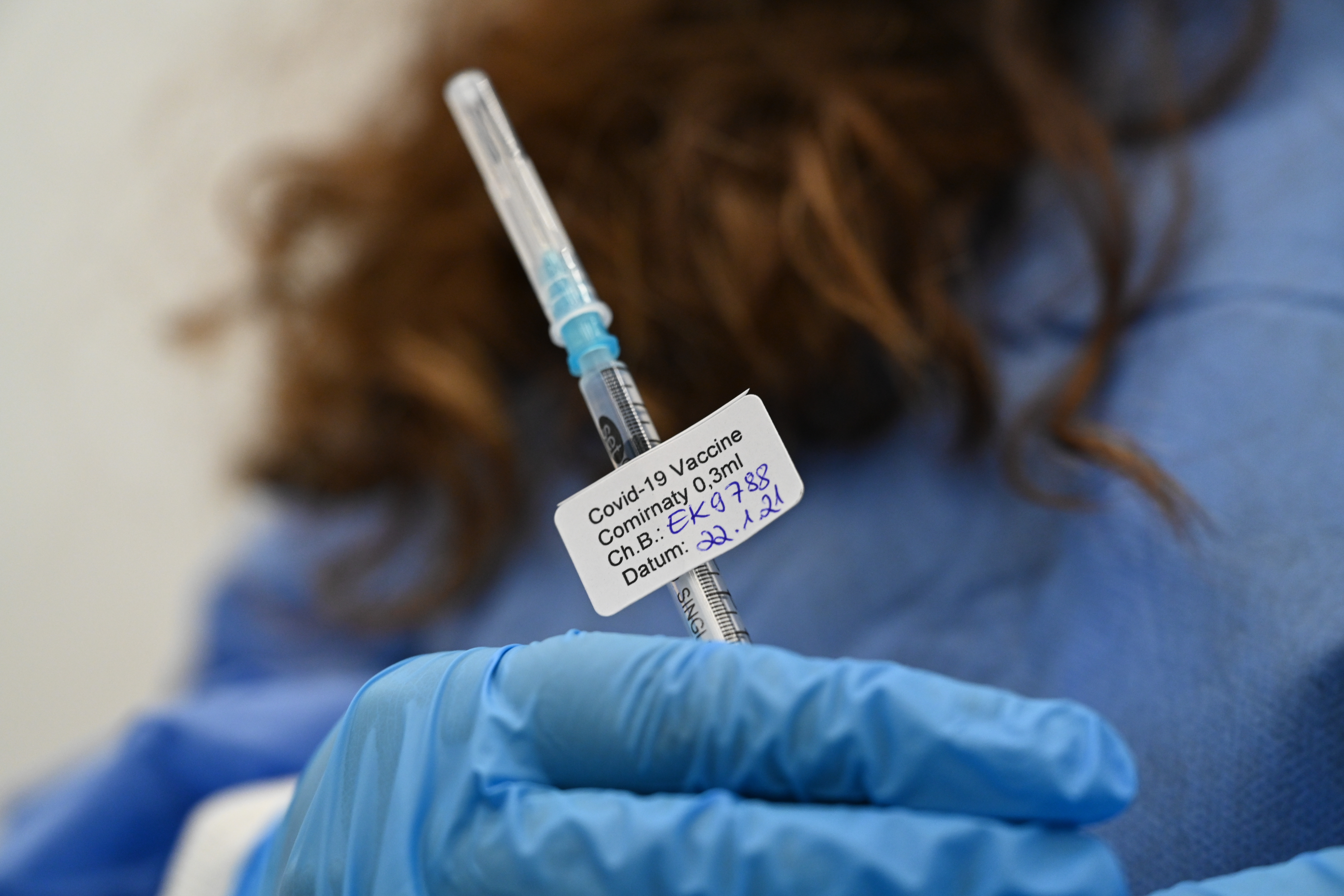 Doctor's assistant Funda Özagac holds a syringe containing the Biontech/Pfizer vaccine against the coronavirus. The WHO has confirmed the vaccine is safe for elderly patients.