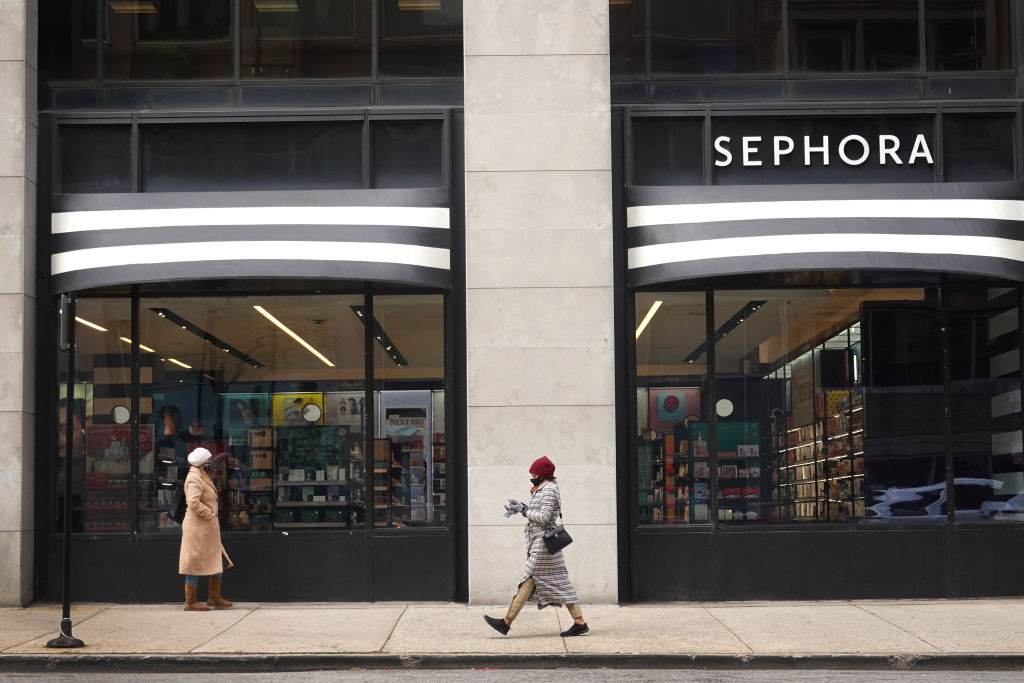A pedestrian walks past a Sephora store along the Magnificent Mile shopping district on December 1, 2020 in Chicago, Illinois. In a partnership announced last month, the beauty products retailer will open mini shops inside 850 Kohl’s stores by 2023.