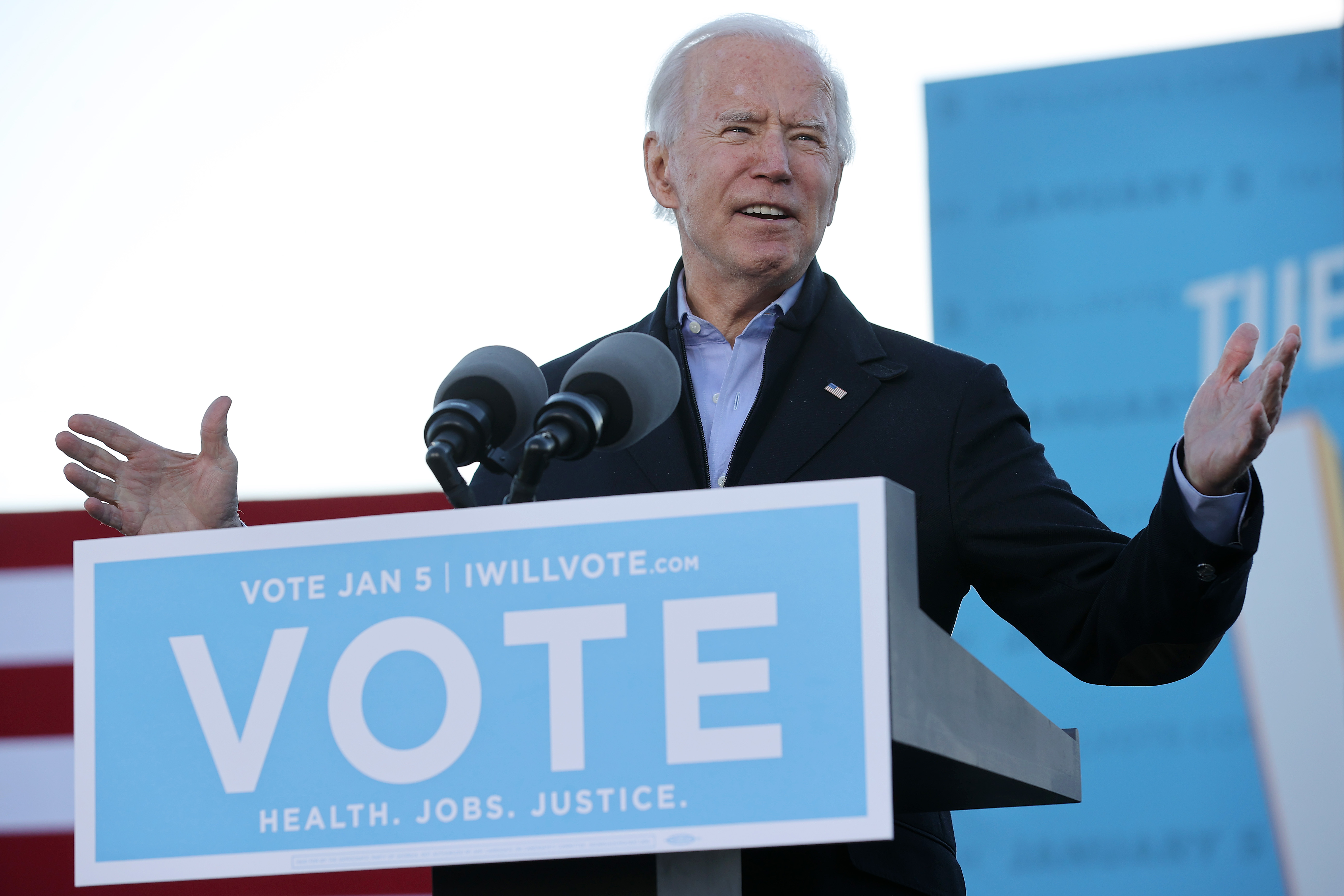 President-elect Joe Biden addresses a campaign rally with Democratic candidates for the U.S. Senate Jon Ossoff and Rev. Raphael Warnock the day before their runoff election in the parking lot of Center Parc Stadium January 04, 2021 in Atlanta, Georgia.