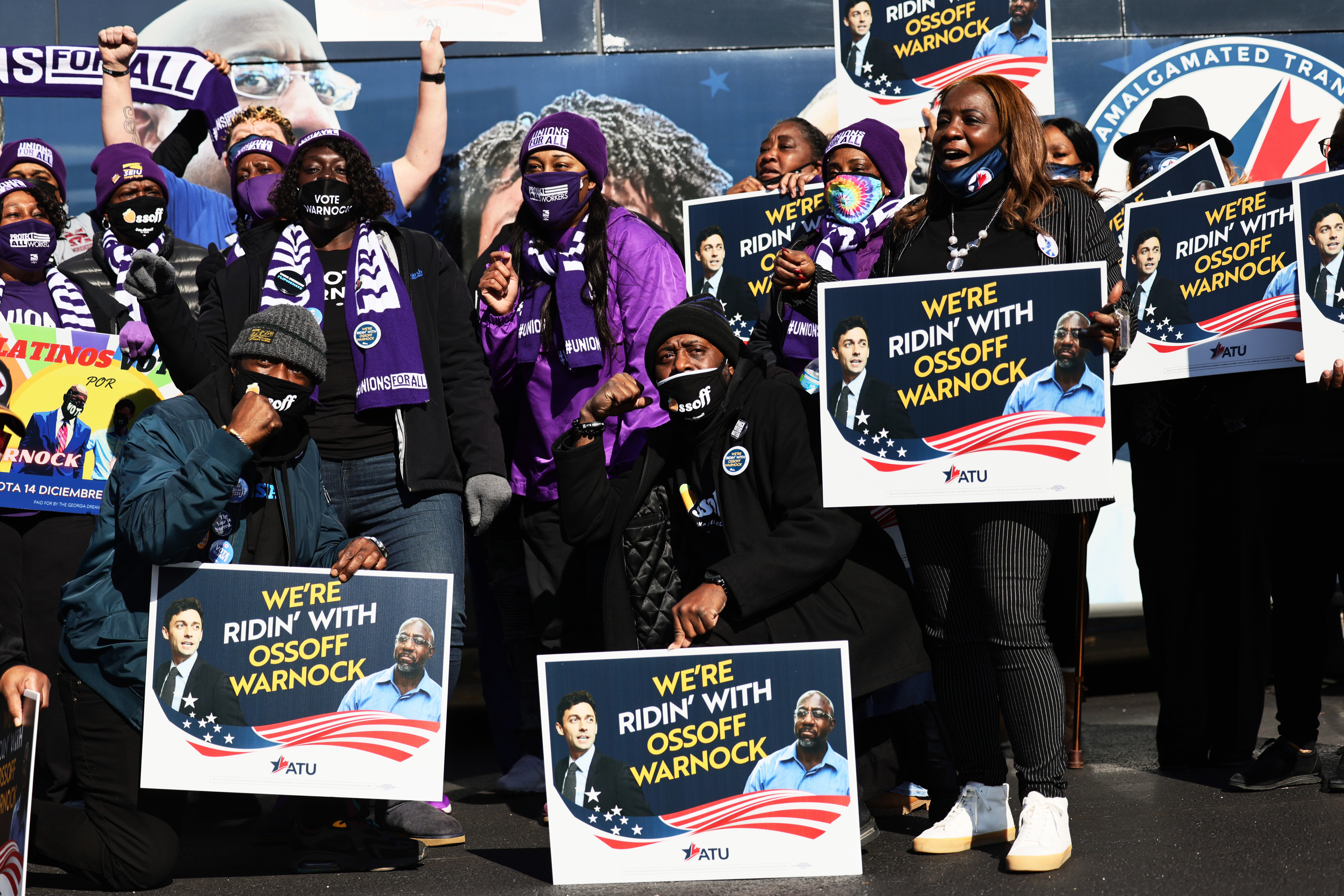 Supporters of Democratic Senate candidate the Rev. Raphael Warnock at a rally at IBEW Local 613 on Jan. 5, 2021, in Marietta, Ga.