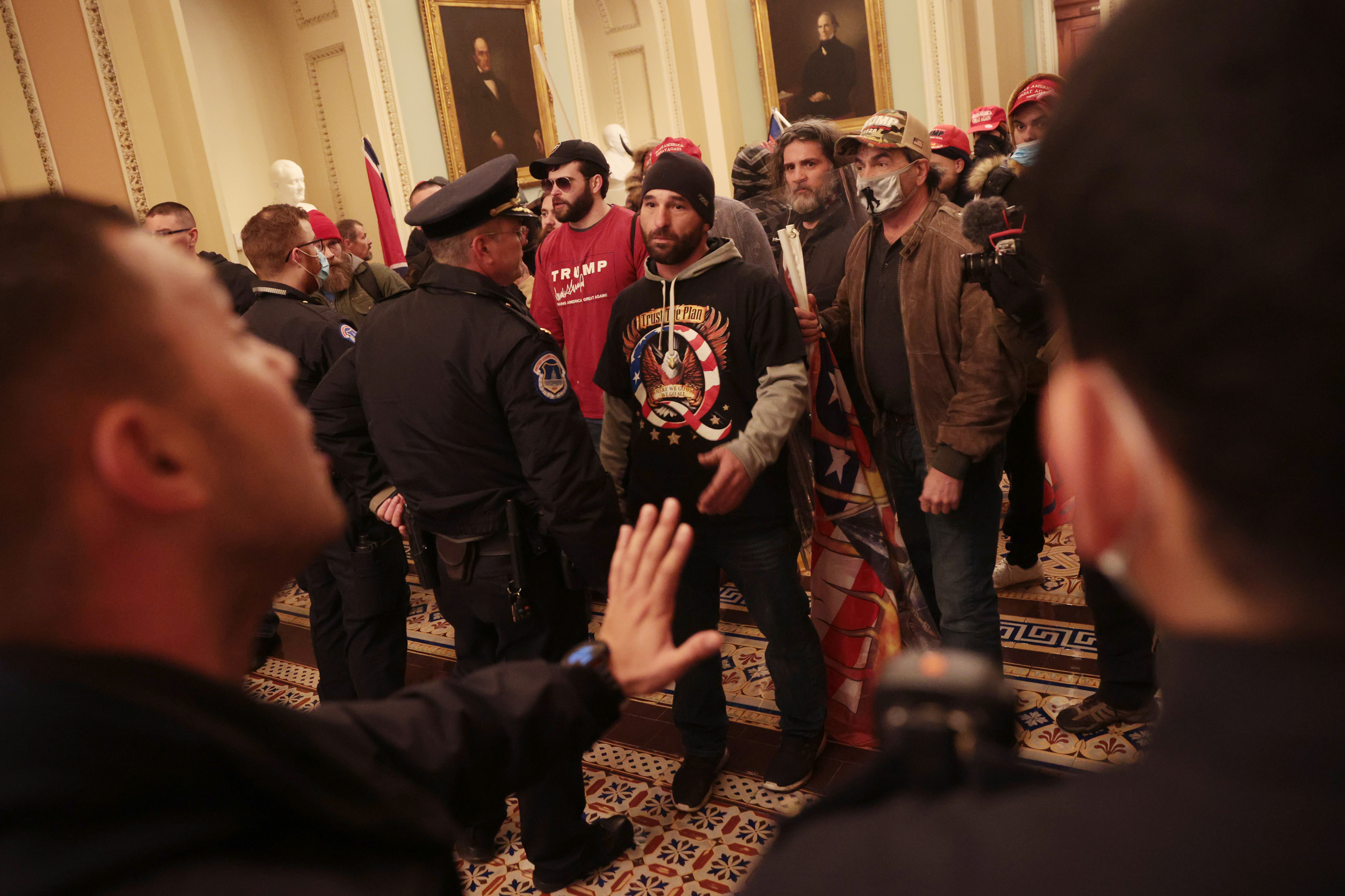 A Capitol Police officer attempts to stop dozens of rioters inside the U.S. Capitol Building on January 6. Serious planning failures by UCSP appear to have made the breach of the Capitol possible.
