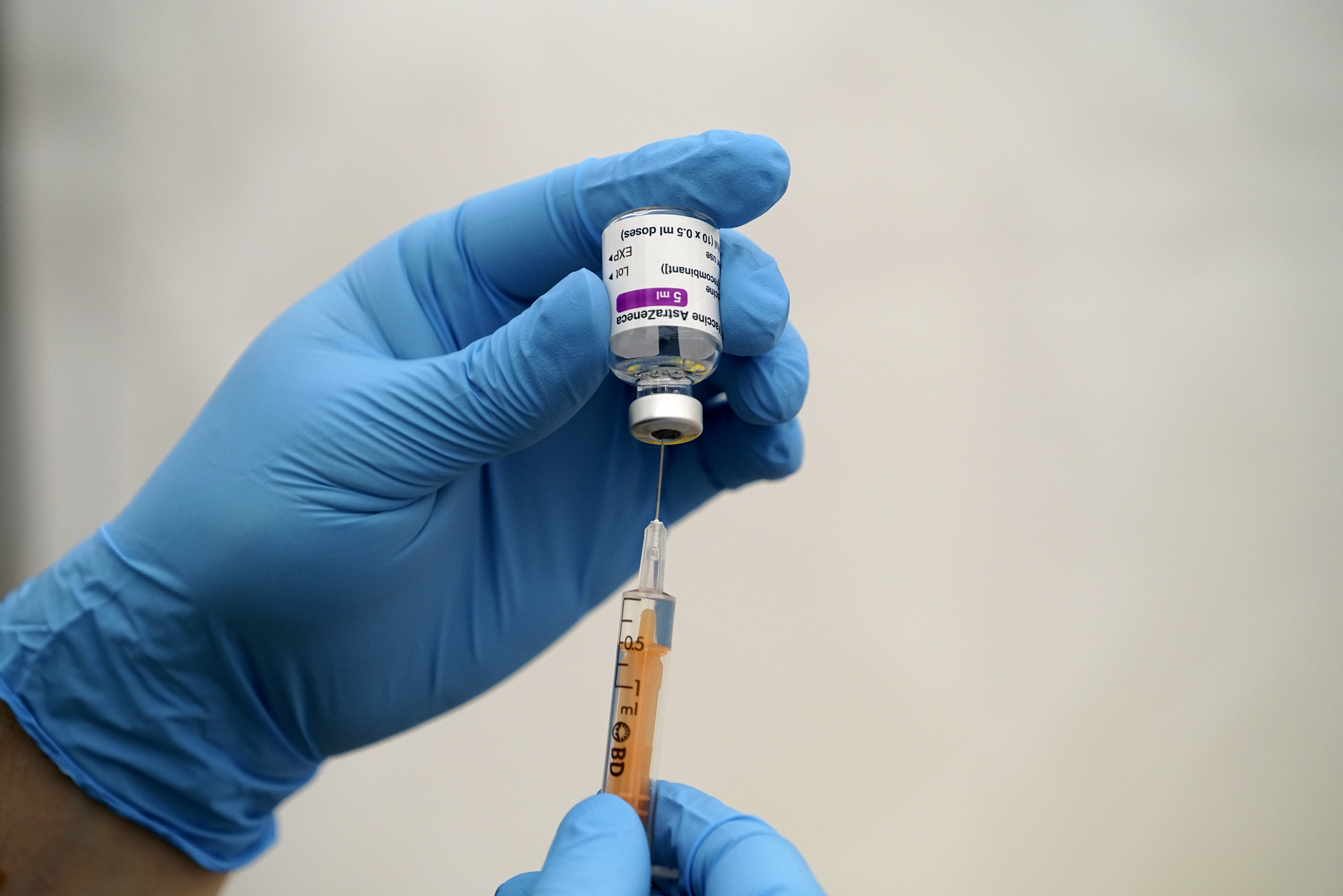 An NHS staff member prepares an AstraZeneca Covid-19 vaccination as over-eighty year olds receive their vaccinations on January 26, 2021 at Stithians Showground, near Truro, England.
