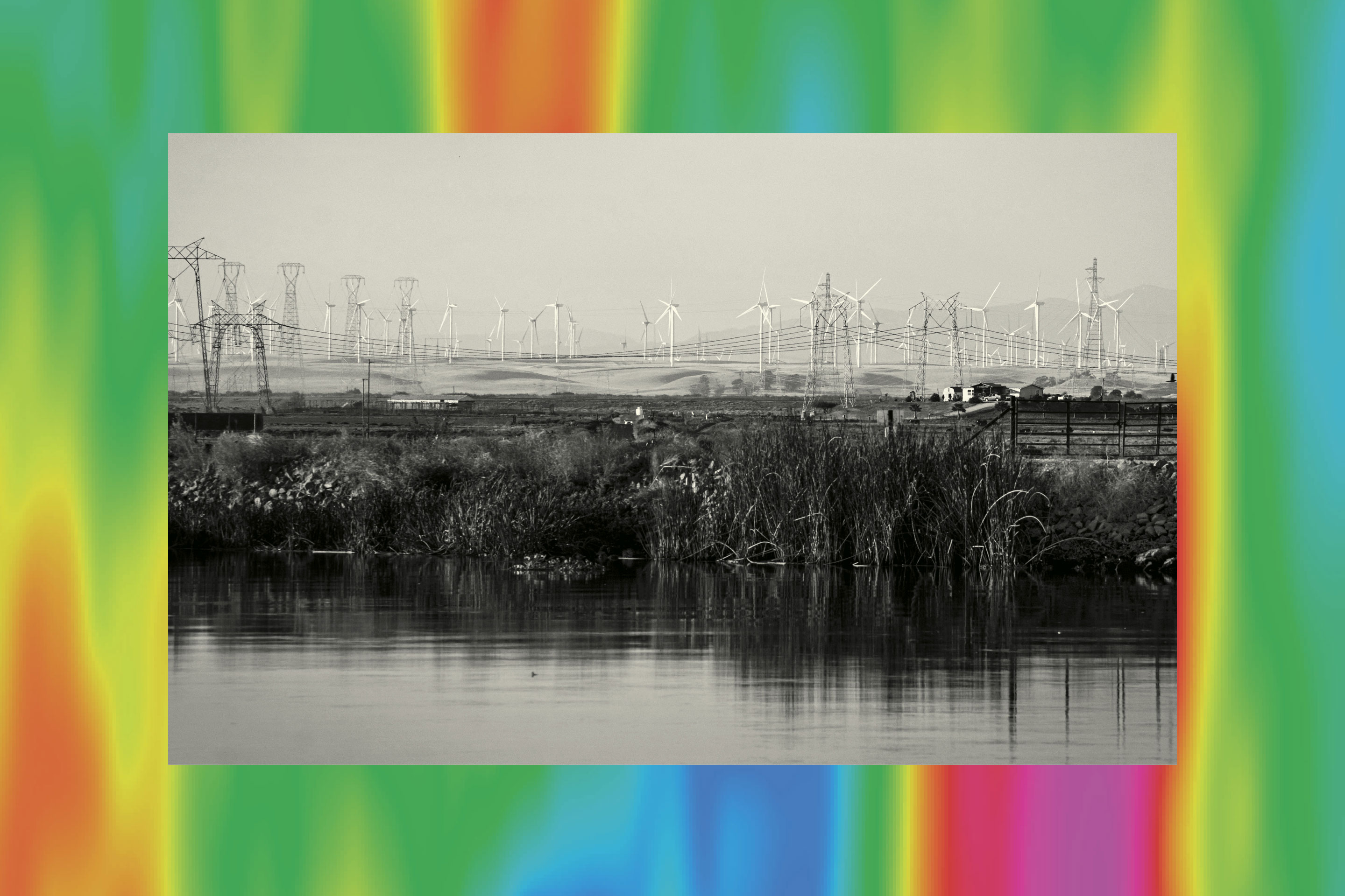 Power poles and wind turbines on Jersey Island, California.