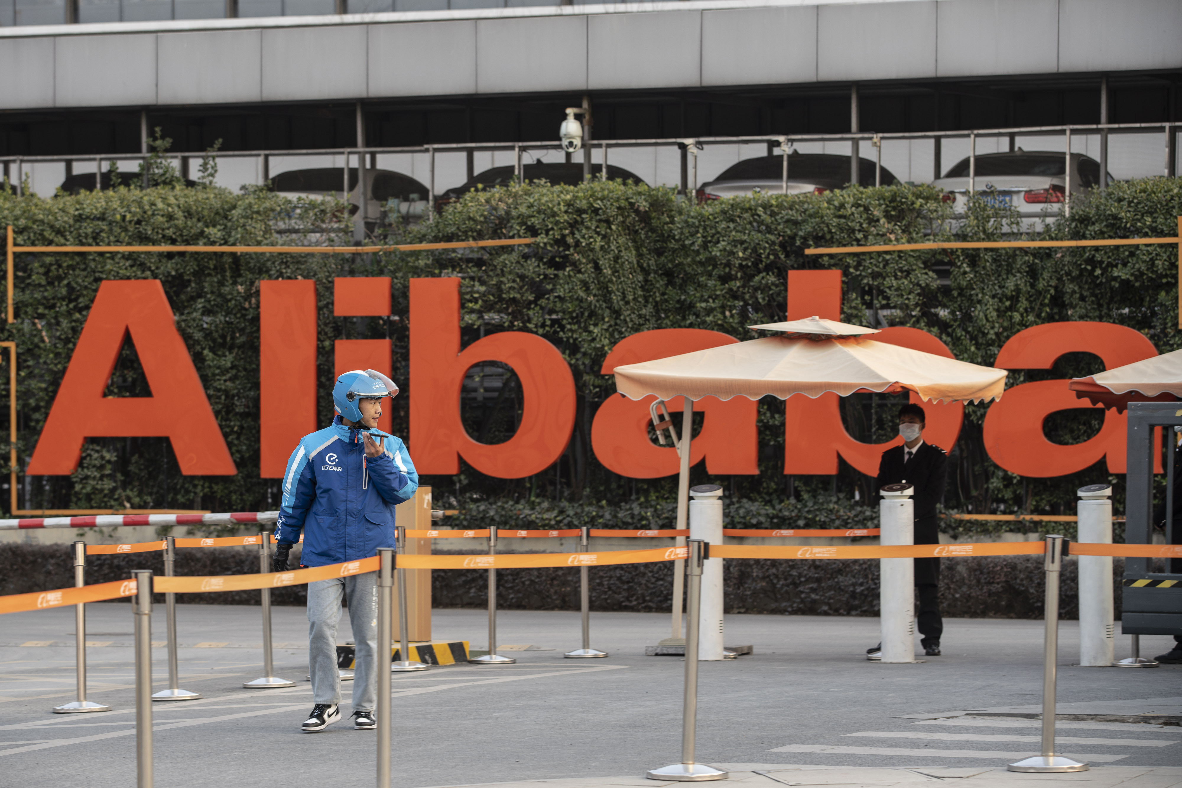 A food delivery worker exits the campus of the Alibaba Group Holding Ltd. headquarters in Hangzhou, China, on Jan. 20, 2021. Alibaba cofounder Jack Ma resurfaced for the first time since China’s government began clamping down on his business empire nearly three months ago, appearing in a livestreamed video that sent Alibaba‘s stock soaring but left plenty of unanswered questions about the billionaire’s fate.