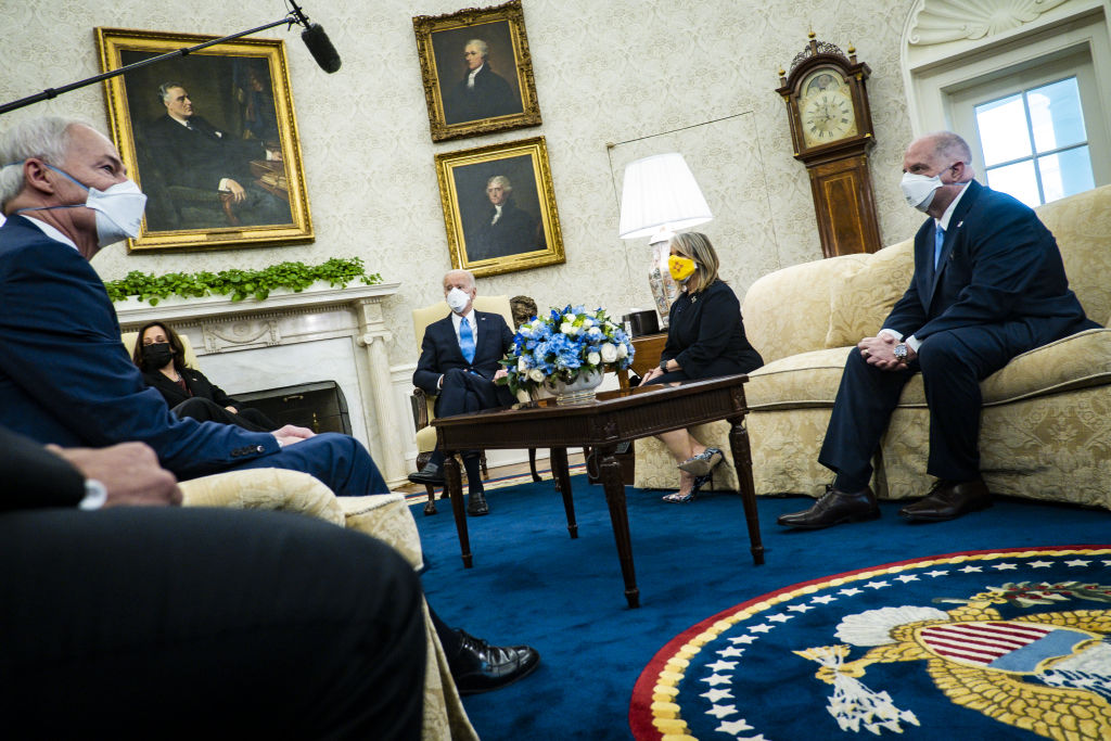 Gov. Larry Hogan of Maryland; Gov. Michelle Lujan Grisham of New Mexico; President Joe Biden; and Vice President Kamala Harris during a meeting with governors and mayors in the Oval Office on Feb. 12, 2021. 