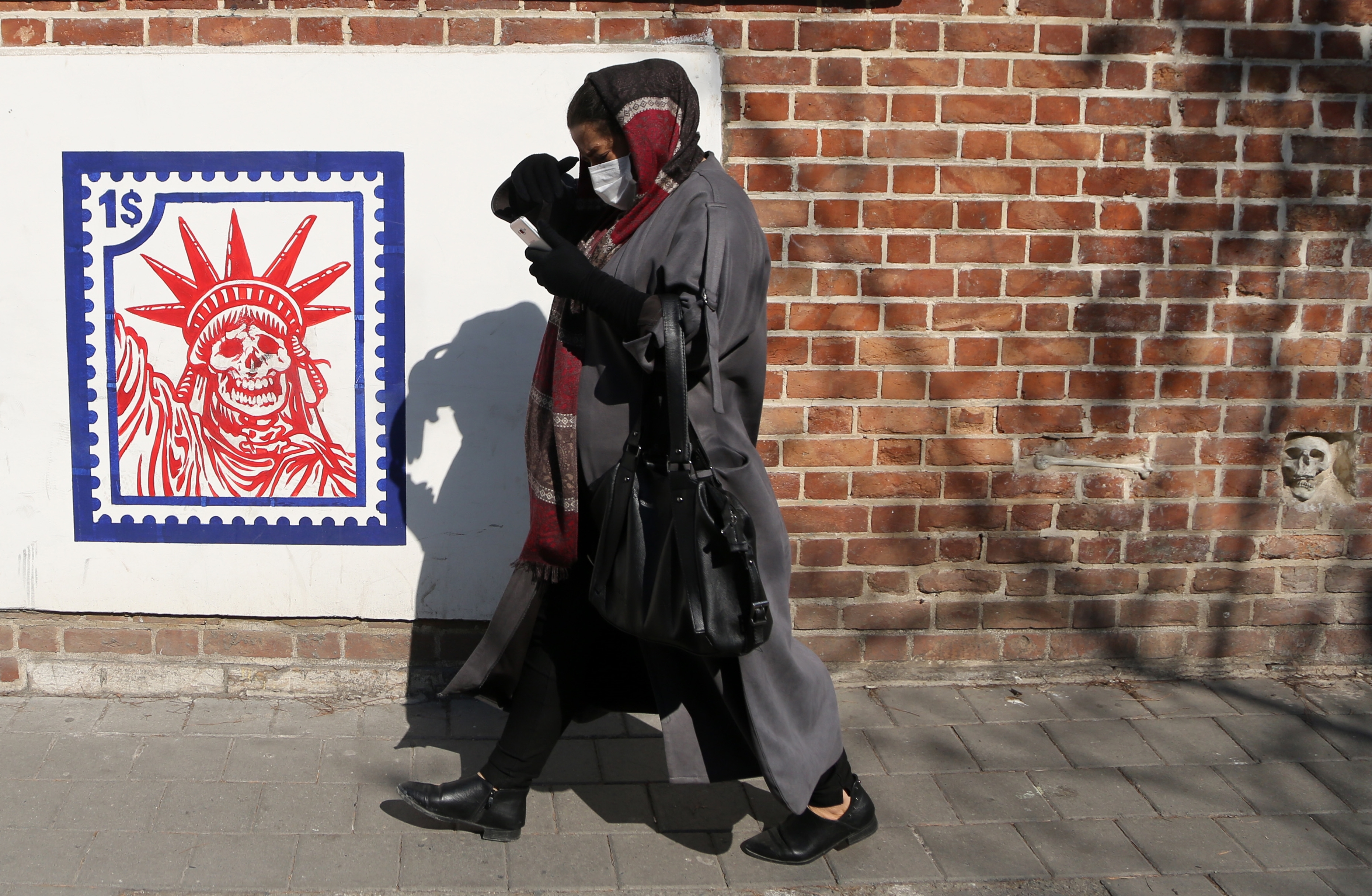 People walk along a street amid coronavirus (Covid-19) in Tehran, Iran on February 16, 2021. Iranians struggling with economic problems and the cost of living, are waiting for the US President Joe Biden to remove the sanctions.