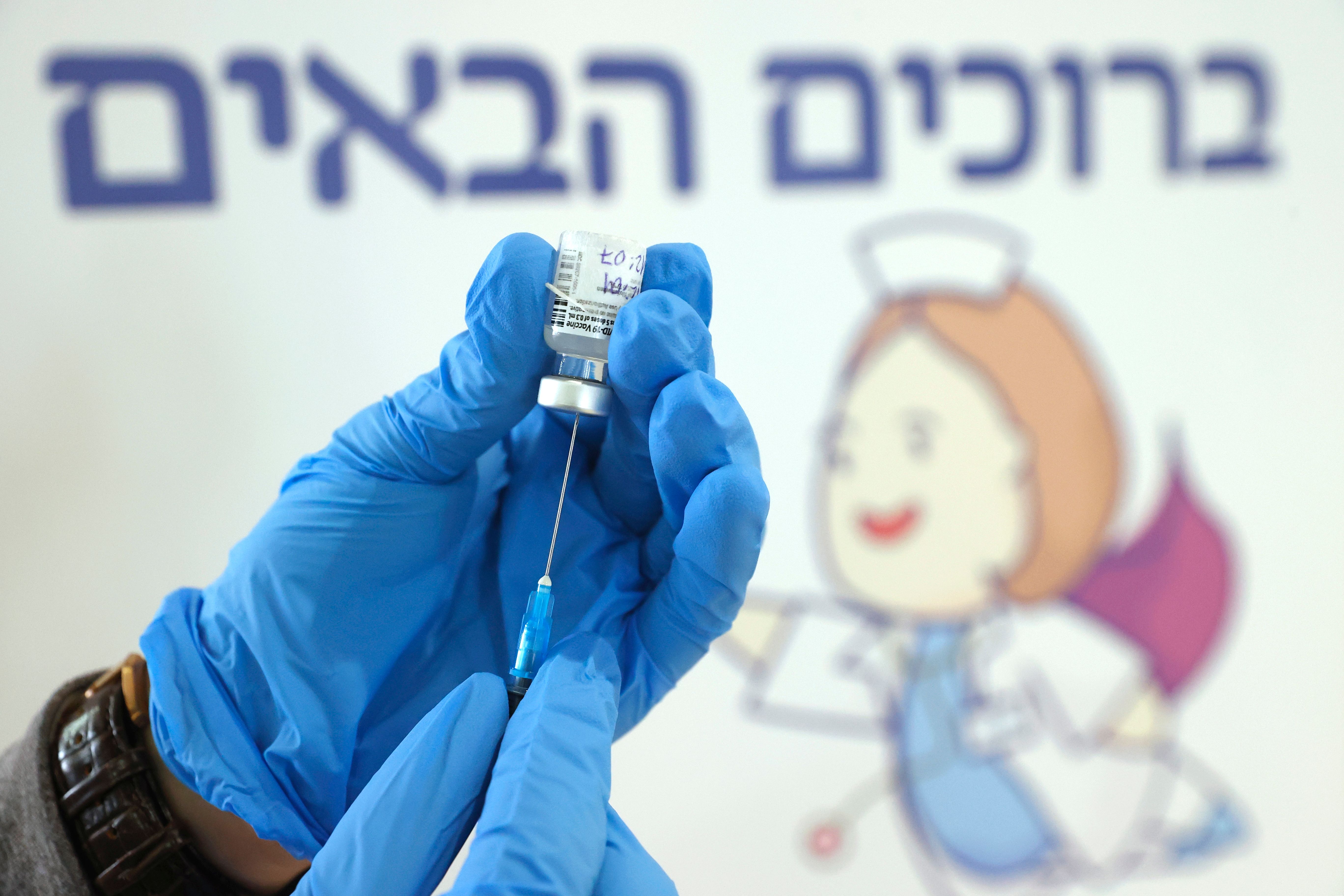 An Israeli health worker of the Maccabi Healthcare Services prepares to administer a dose of the Pfizer-BioNtech vaccine on February 24, 2021 in Tel Aviv.