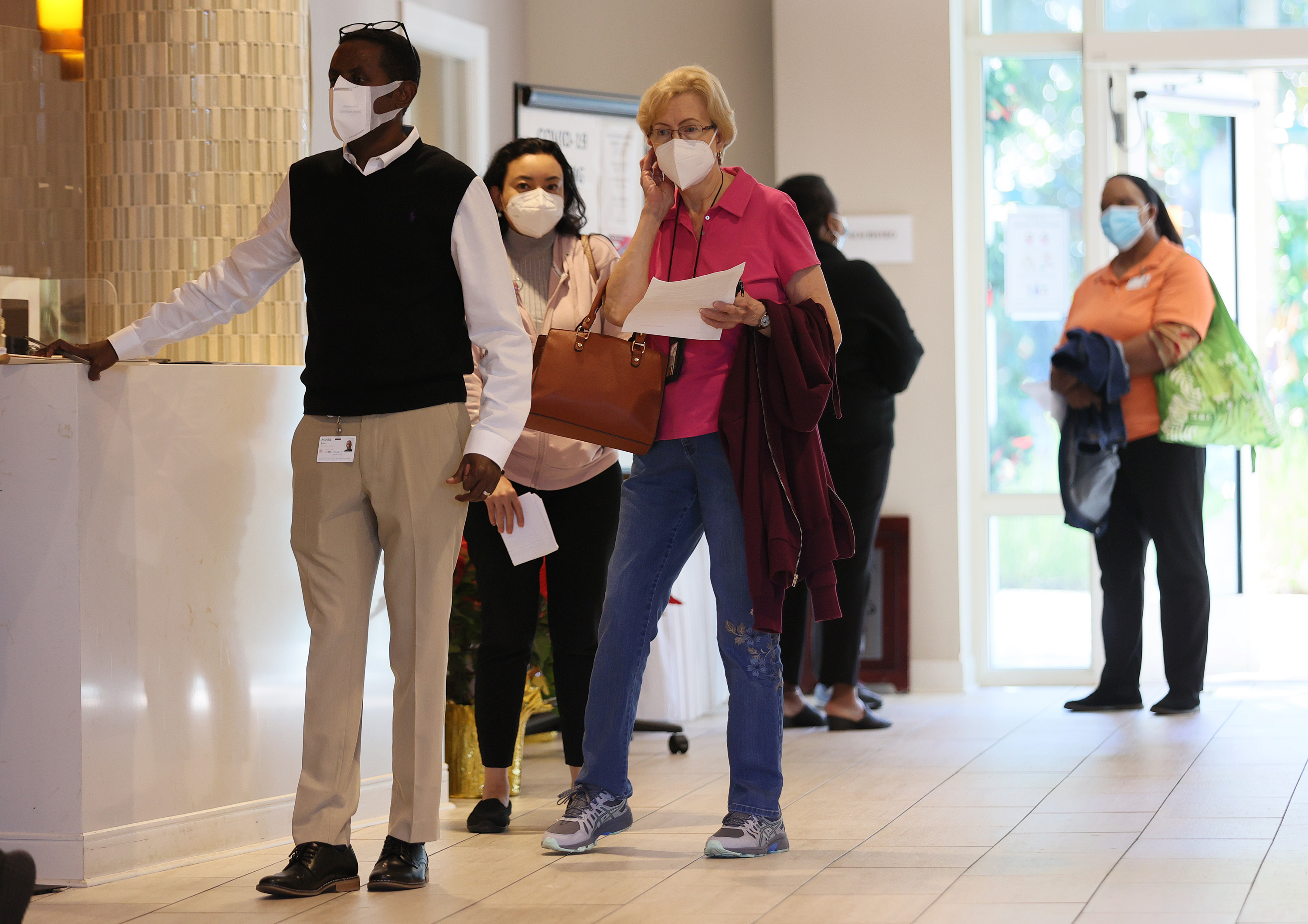 People line up to receive a COVID-19 vaccine at the John Knox Village Continuing Care Retirement Community in Pompano Beach, Fla. “One of the most positive signs I’ve seen emerging from this crisis is the recognition that the generations are connected and do look out for one another,” writes Jo Ann Jenkins.