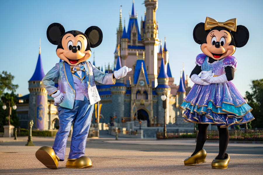 Mickey and Minnie Mouse dressed in special attire for the 50th anniversary celebration of the Walt Disney World Resort in Orlando.