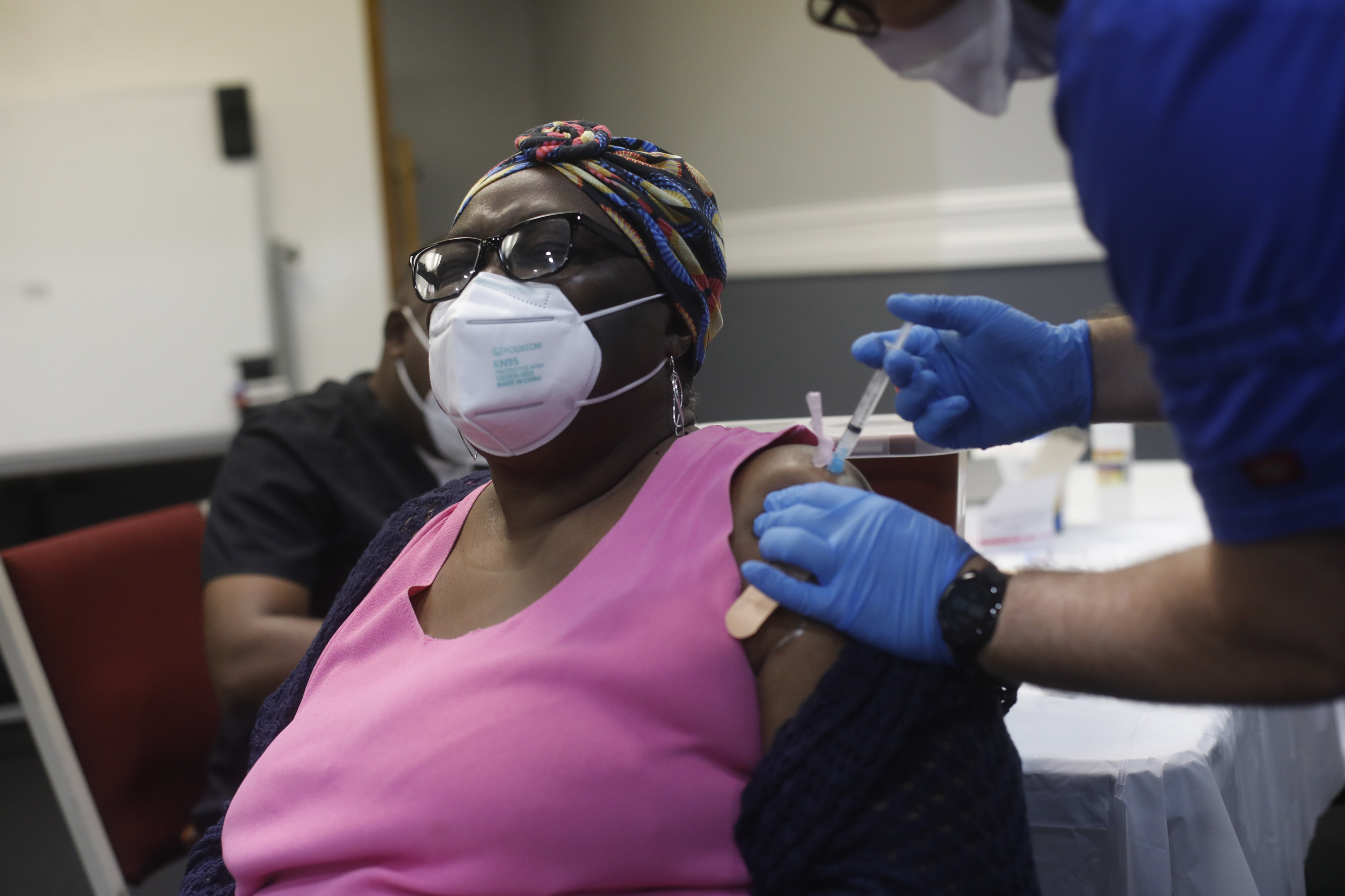 A patient receives the Moderna COVID-19 vaccine in Tampa. A new Census survey found that a surprisingly large number of Americans are unaware that the vaccine is being provided free of charge.